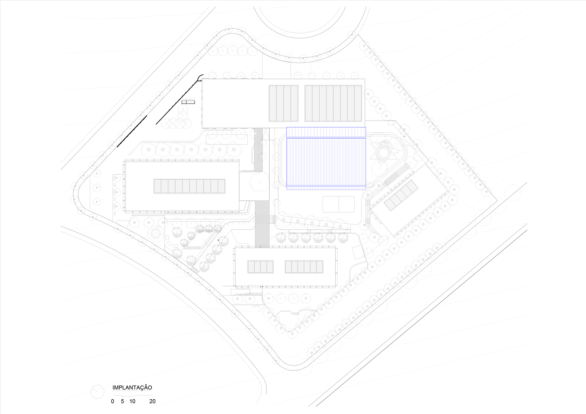 Site plan drawing showing campus layout with rectangular buildings and central sports field