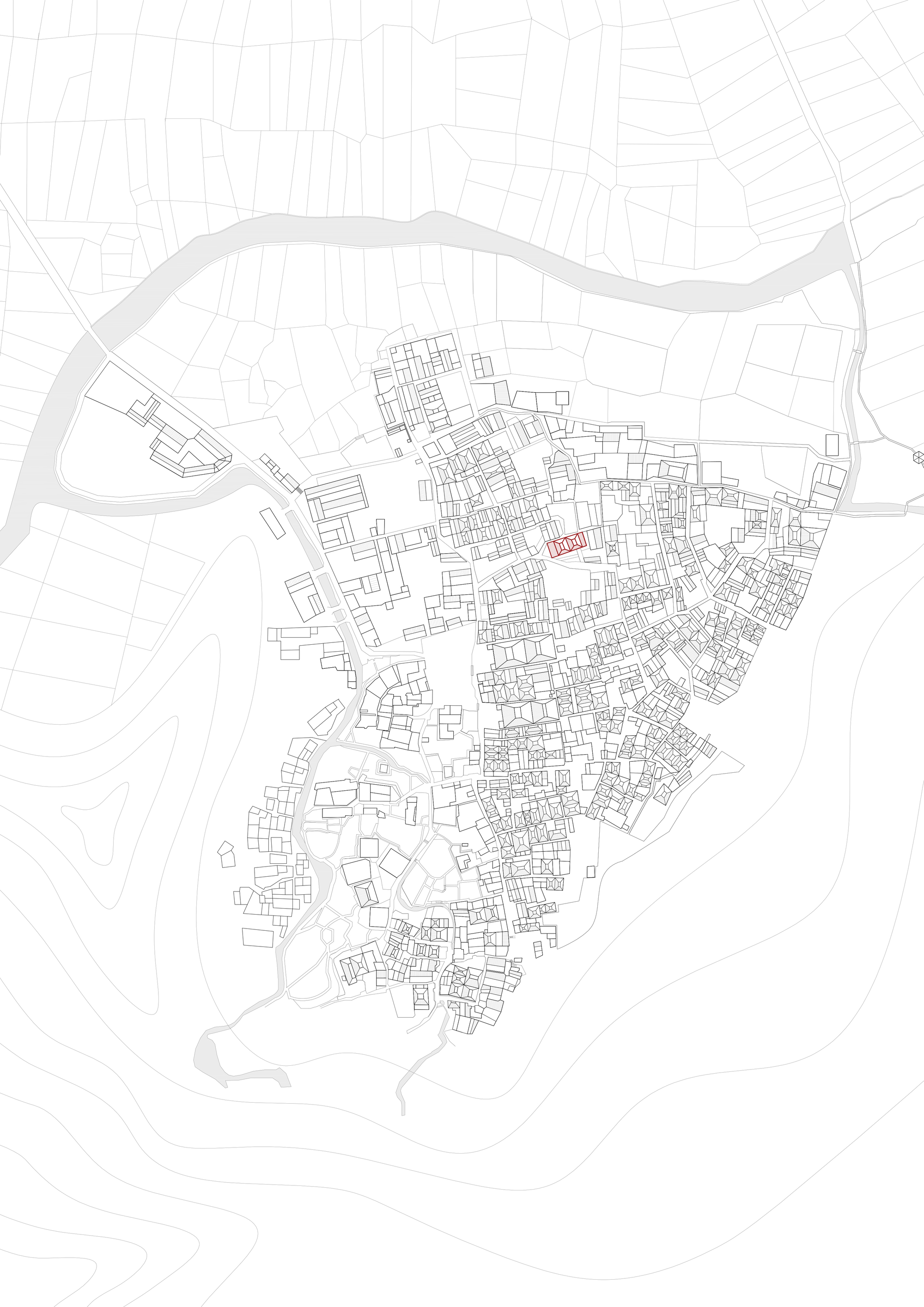 Site plan drawing showing dense urban fabric with a highlighted building near a river bend