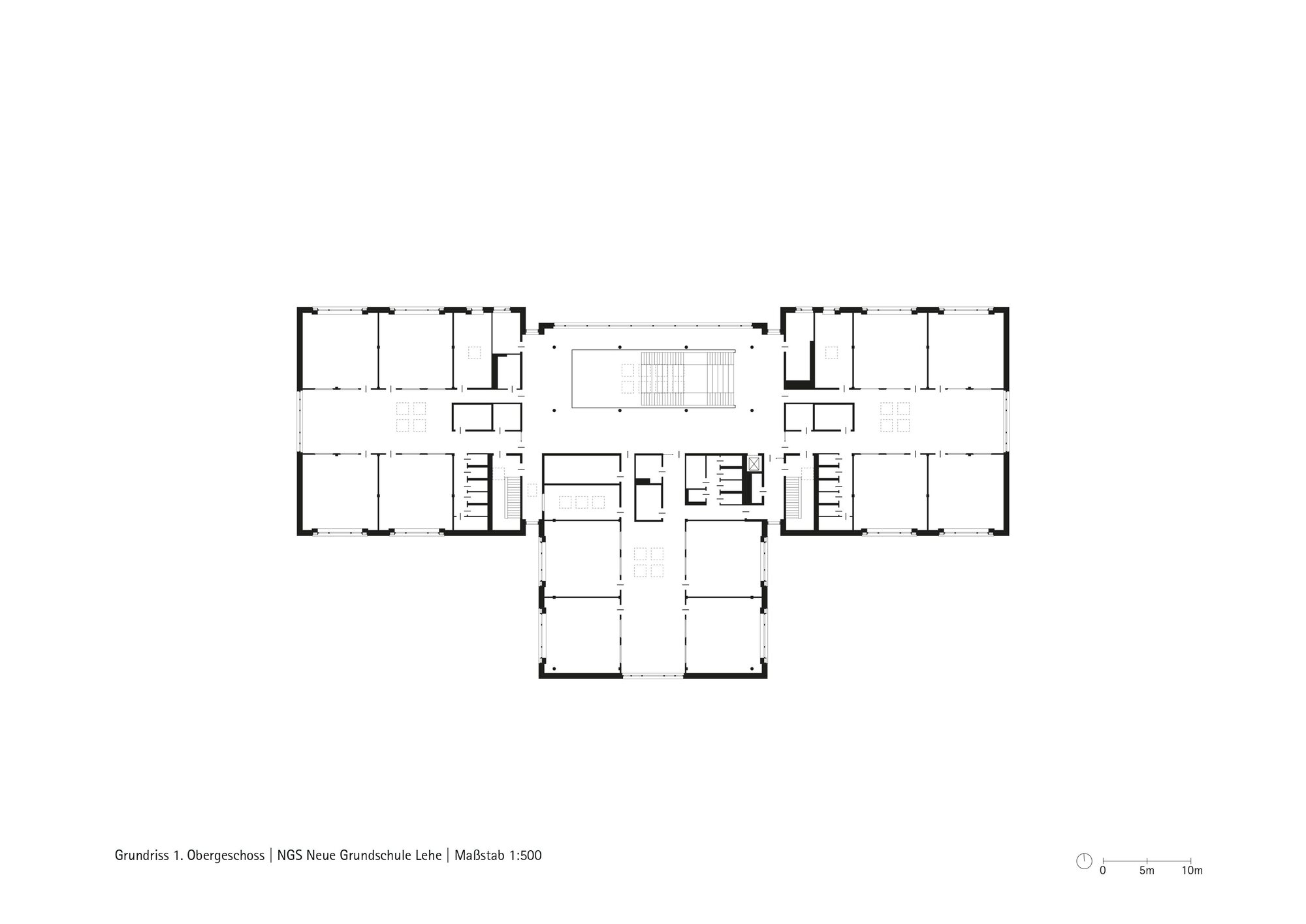 Upper floor plan drawing showing a symmetrical wing layout with central stair and service cores