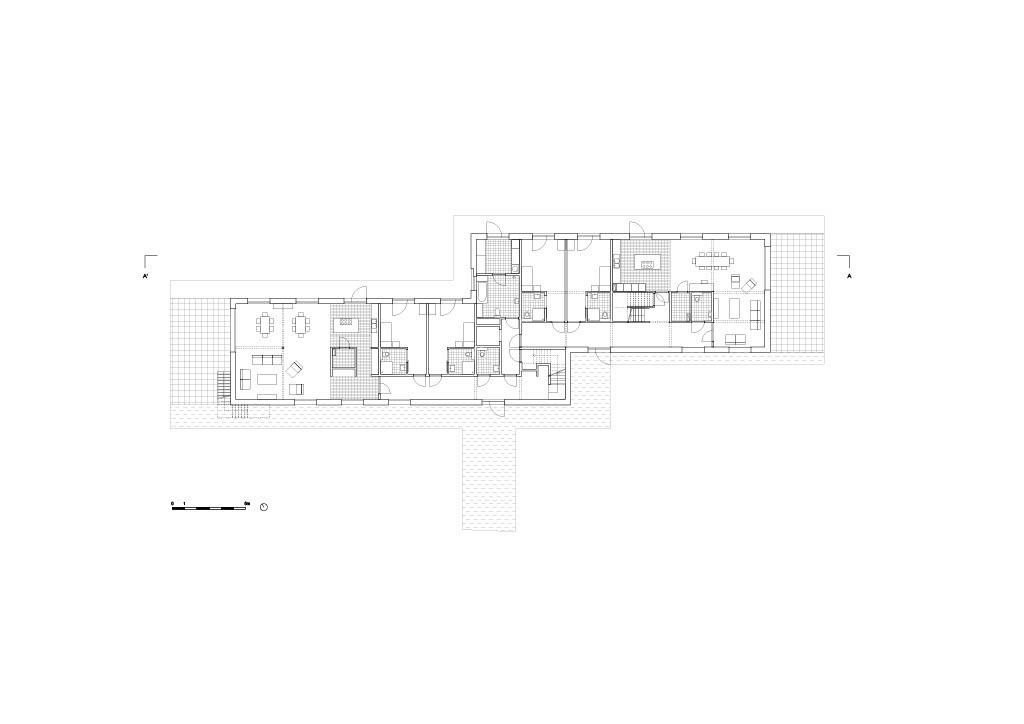 Ground floor plan showing residential units with terraces and central circulation core