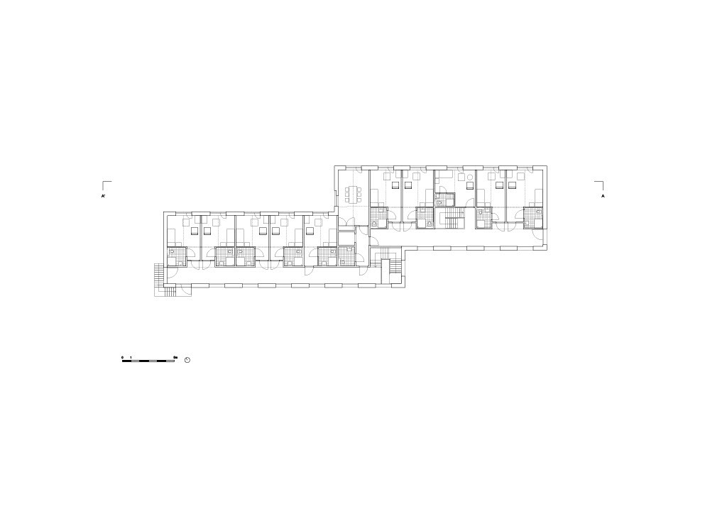 Upper floor plan showing individual dwelling units arranged along a linear corridor