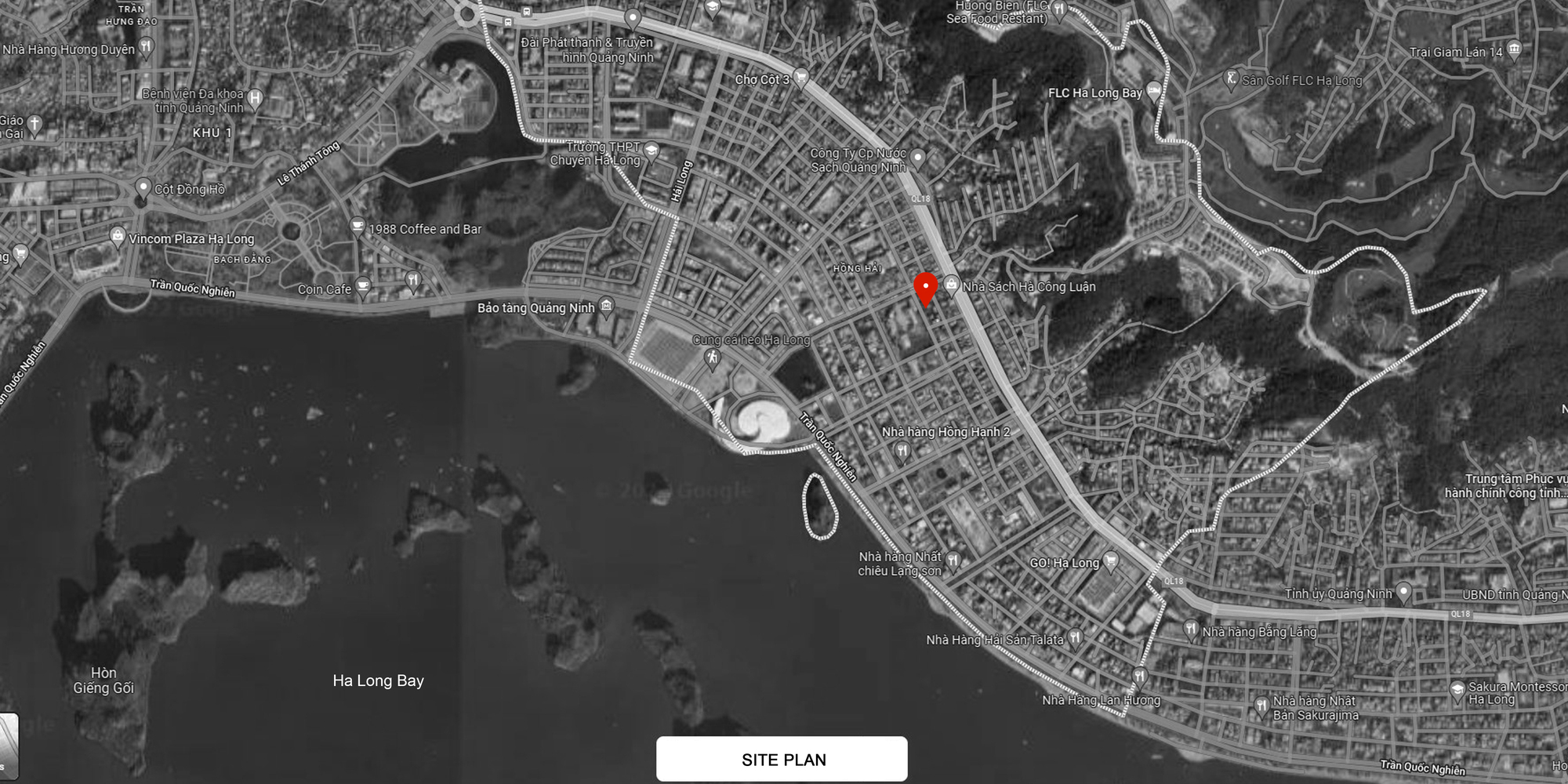 Site plan drawing showing the project location marked in red within a coastal urban grid