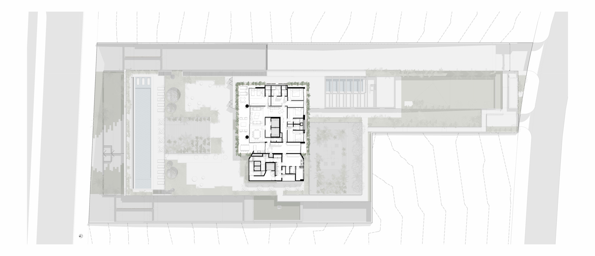 Roof plan showing the building footprint with adjacent landscaped courtyards and property boundary