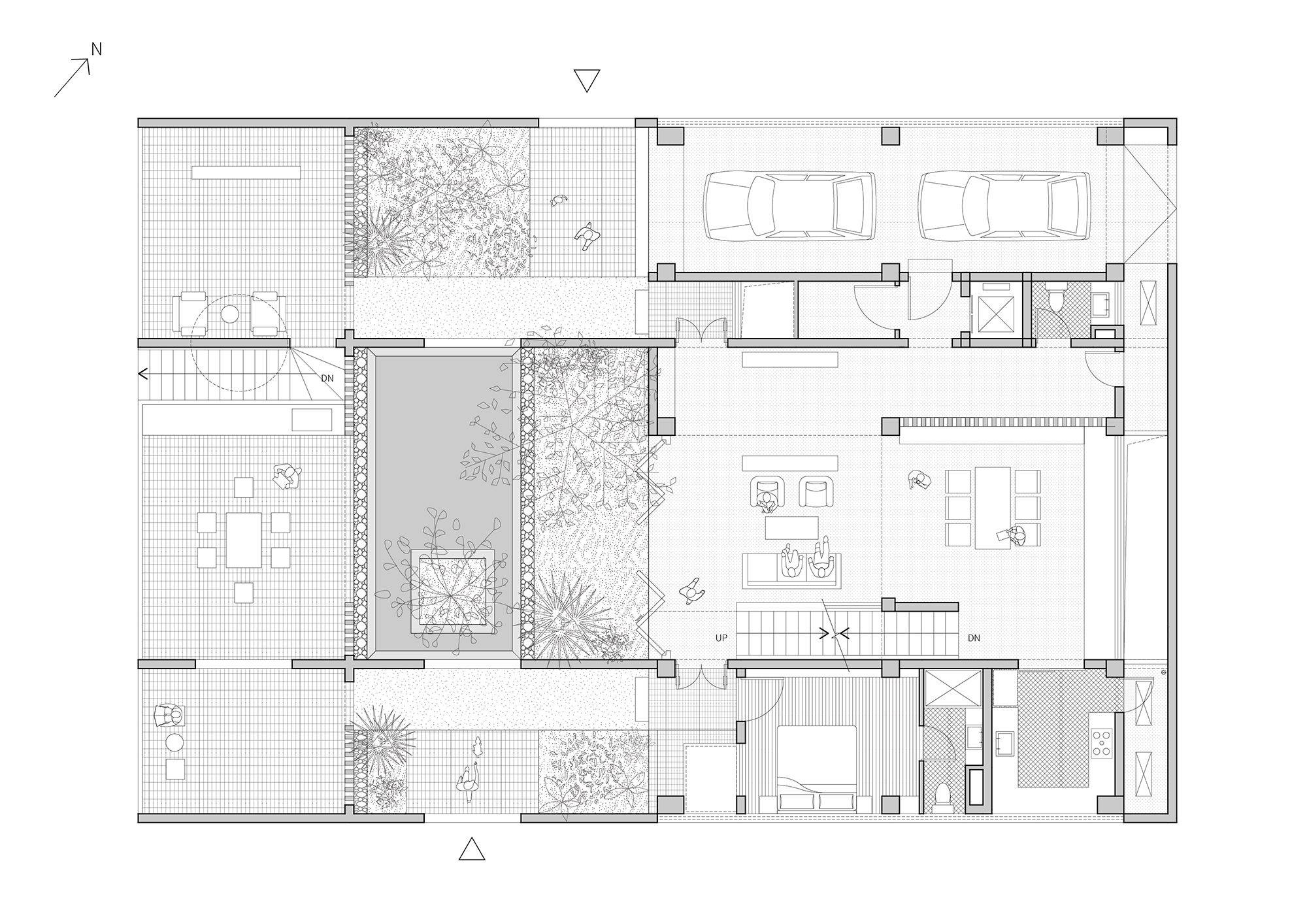 Ground floor plan showing living spaces organized around two internal courtyards with planted gardens