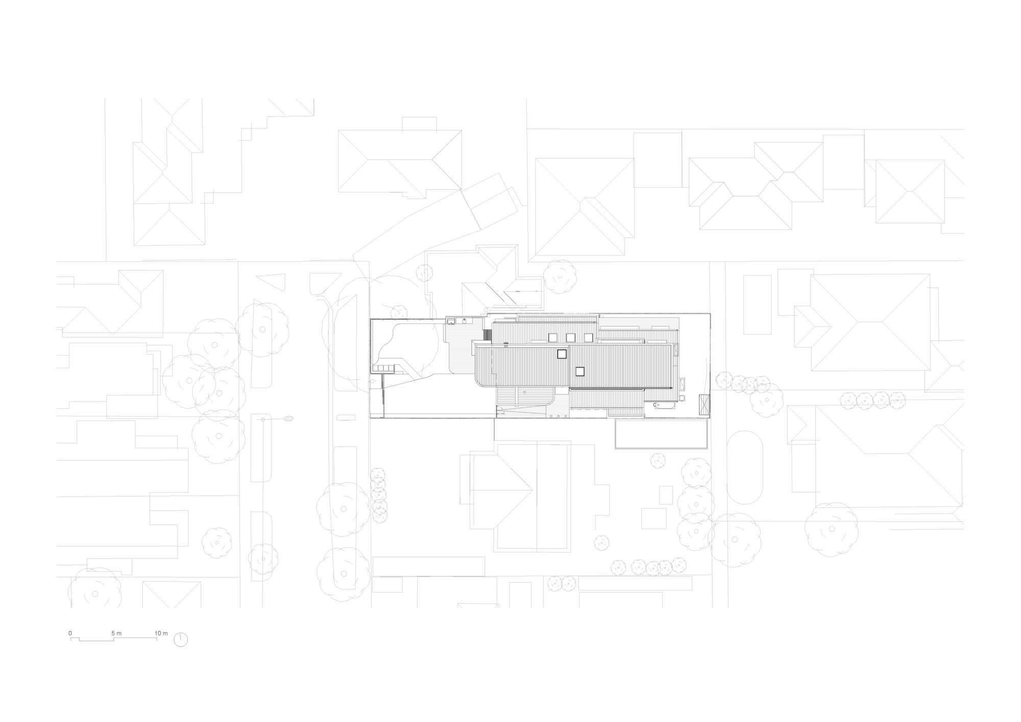Site plan drawing showing a narrow rectangular building footprint surrounded by neighboring structures and landscape elements