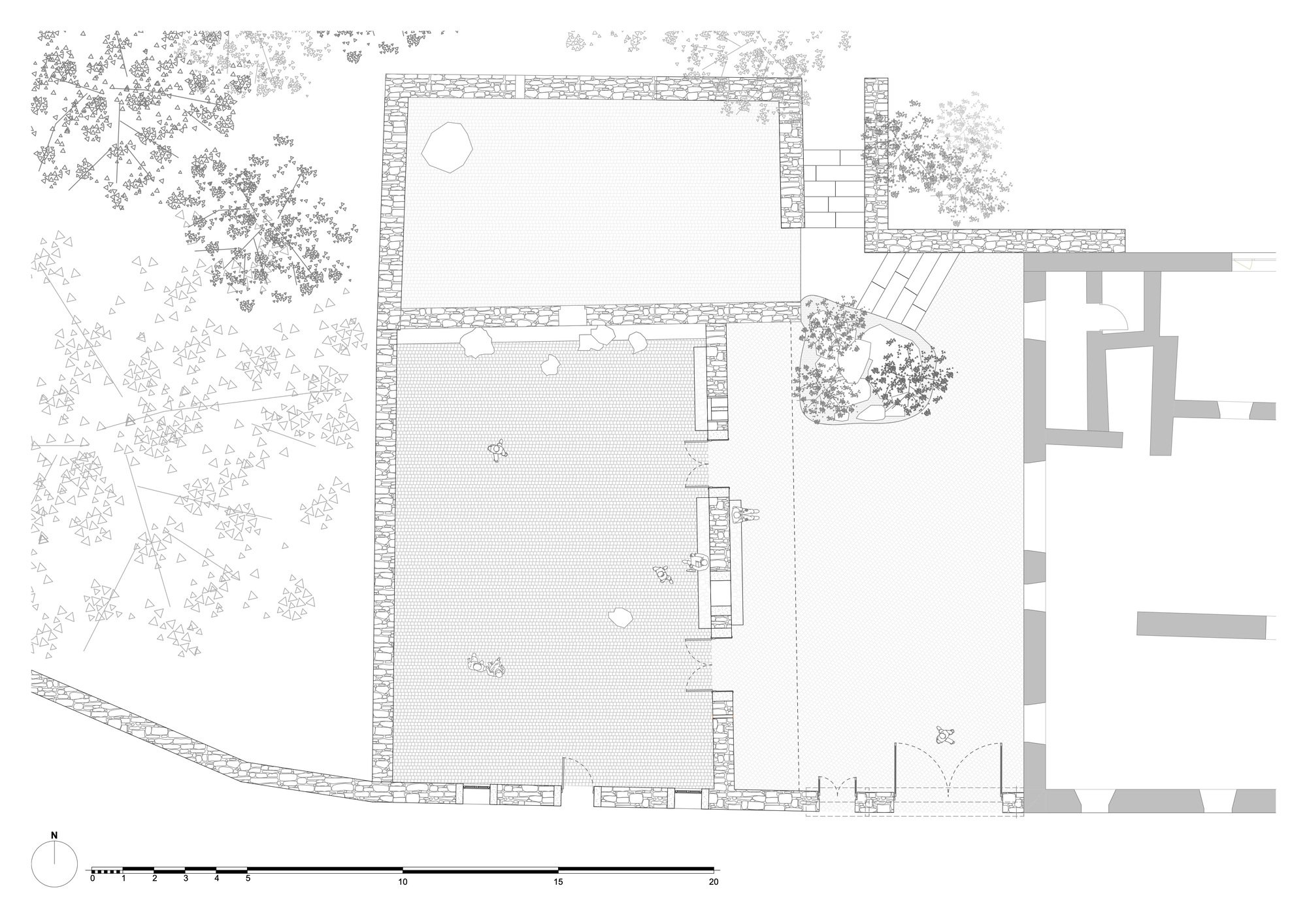 Floor plan drawing showing two rectangular volumes with stone walls and surrounding tree canopies