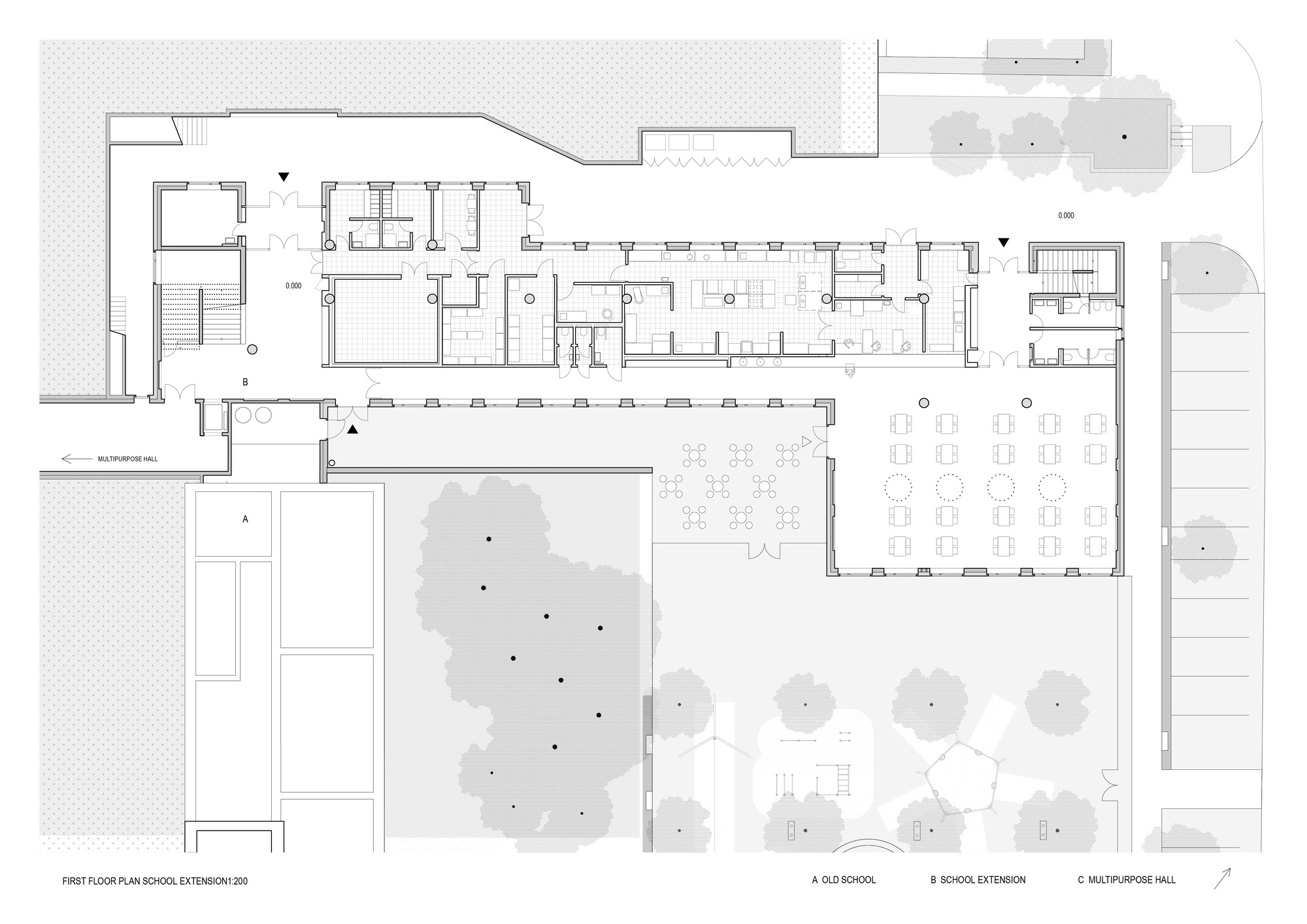 First floor plan drawing showing classrooms wrapping a landscaped courtyard with multiple circulation zones