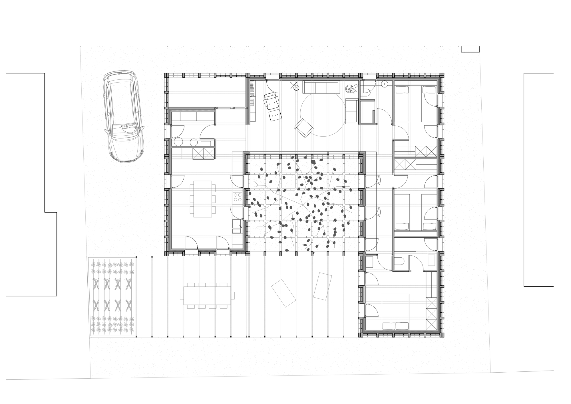 Floor plan drawing showing rooms arranged around a central courtyard with a tree and pebble ground cover
