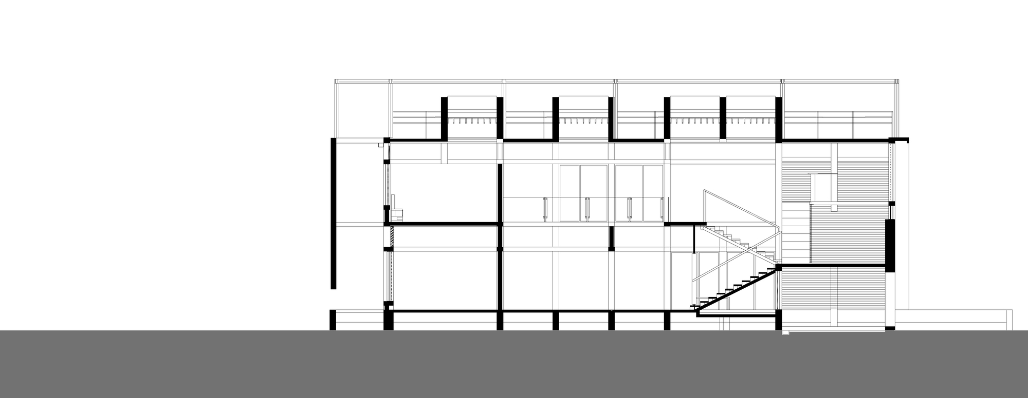 Section drawing revealing split-level interior spaces with staircase connecting multiple floor plates