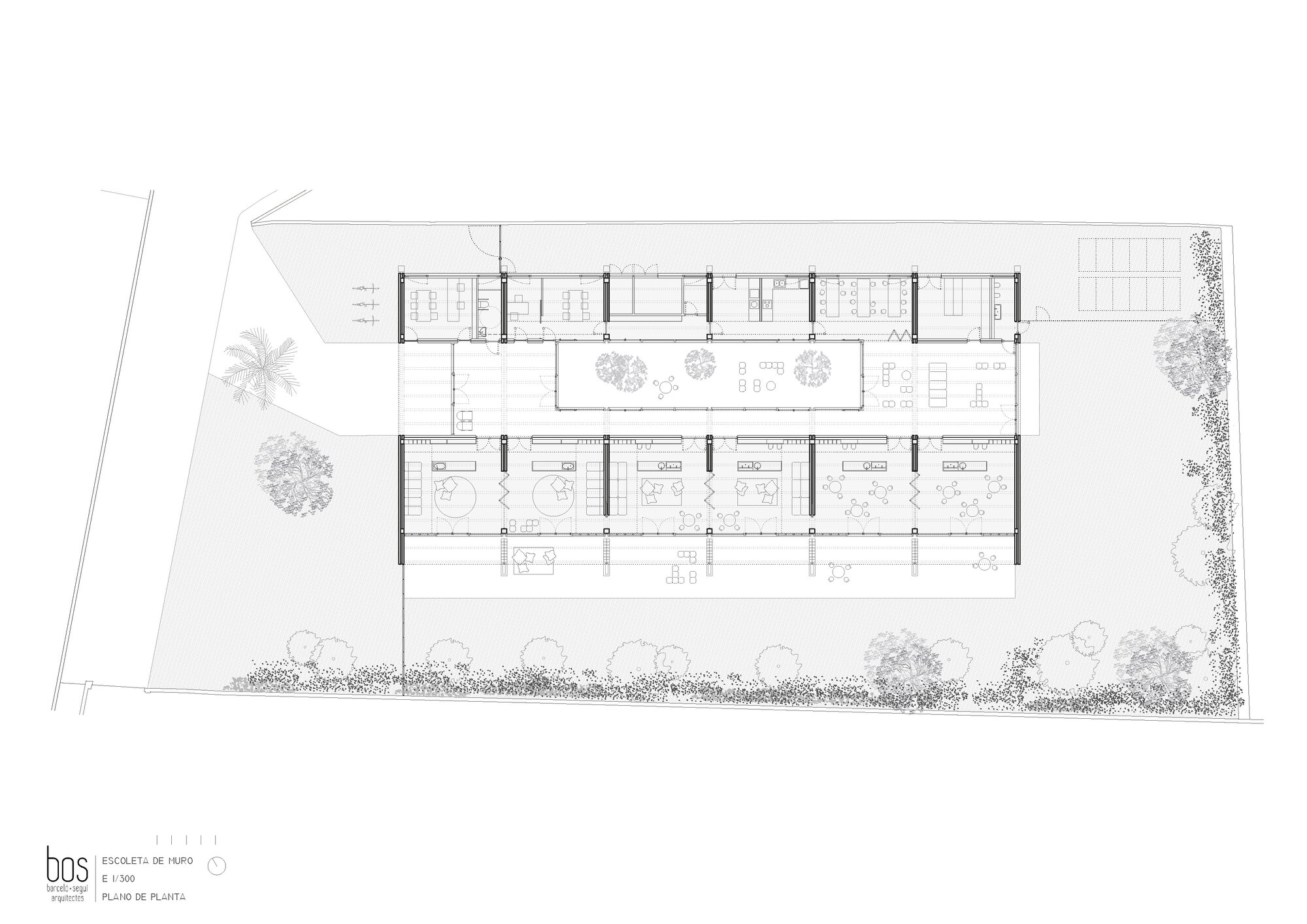 Floor plan drawing showing a series of classrooms flanking a central courtyard with planted trees