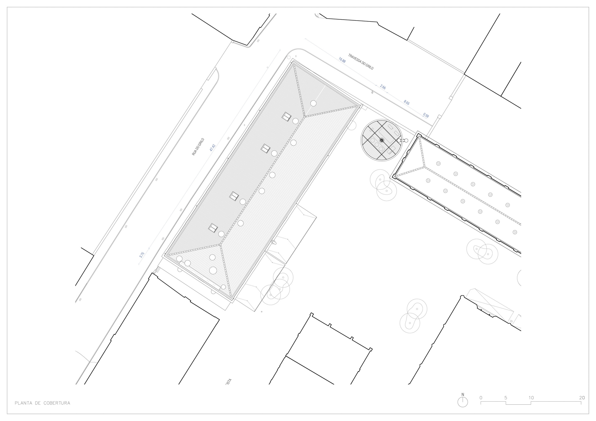 Site plan drawing showing a pentagonal volume and adjacent circular structure within an urban block