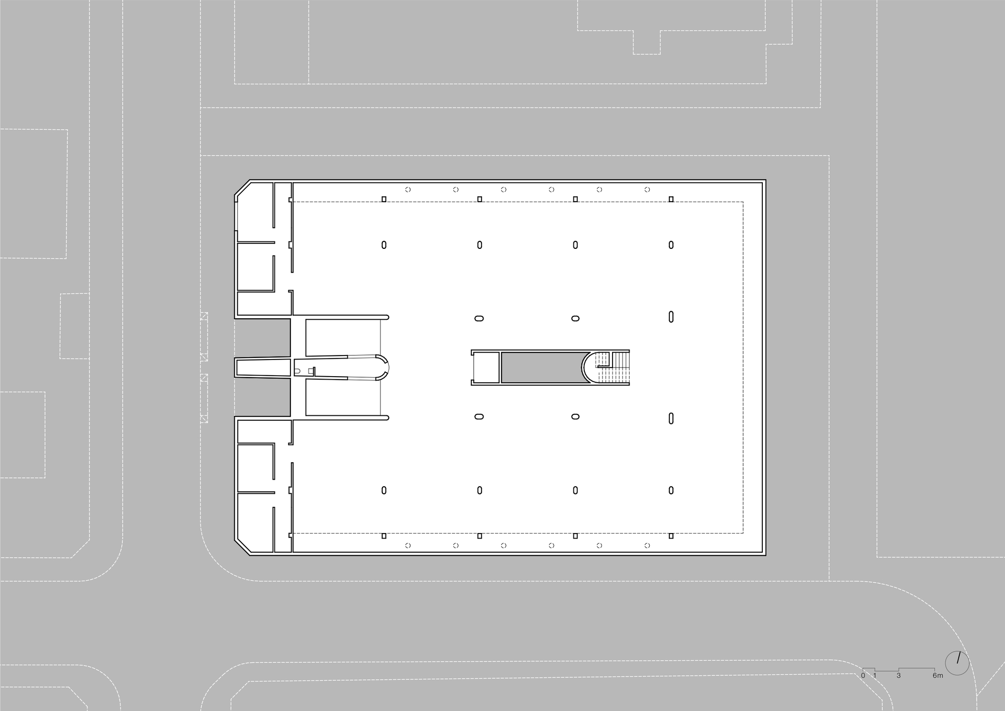 Ground floor plan drawing showing open parking layout with central stair and service core