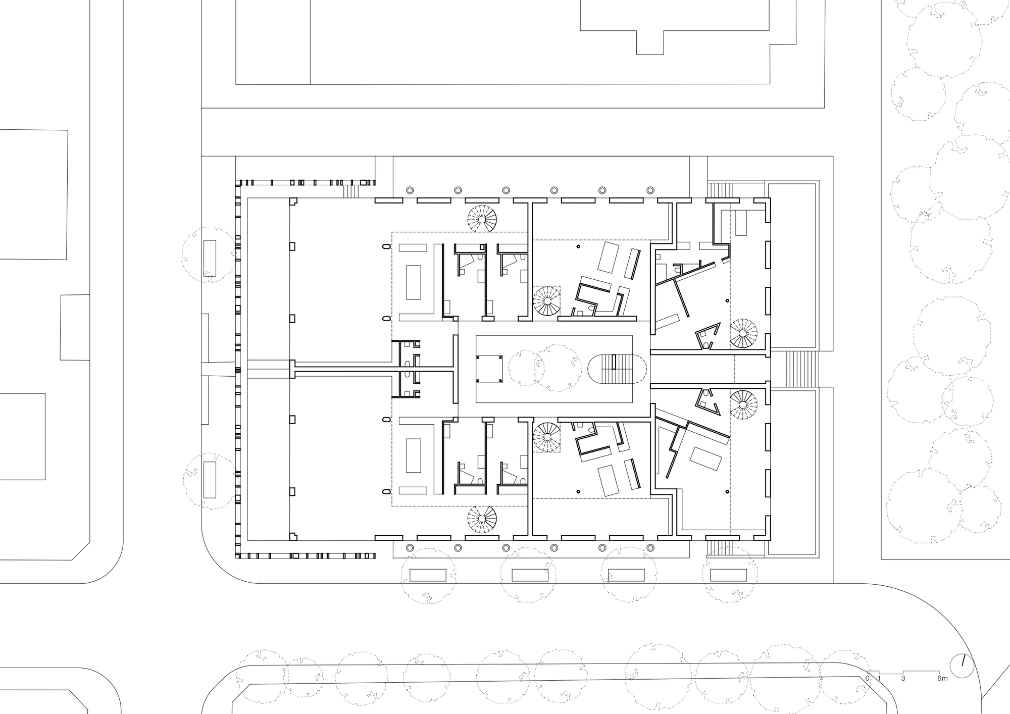 First floor plan drawing showing units with angled balconies and interior courtyards
