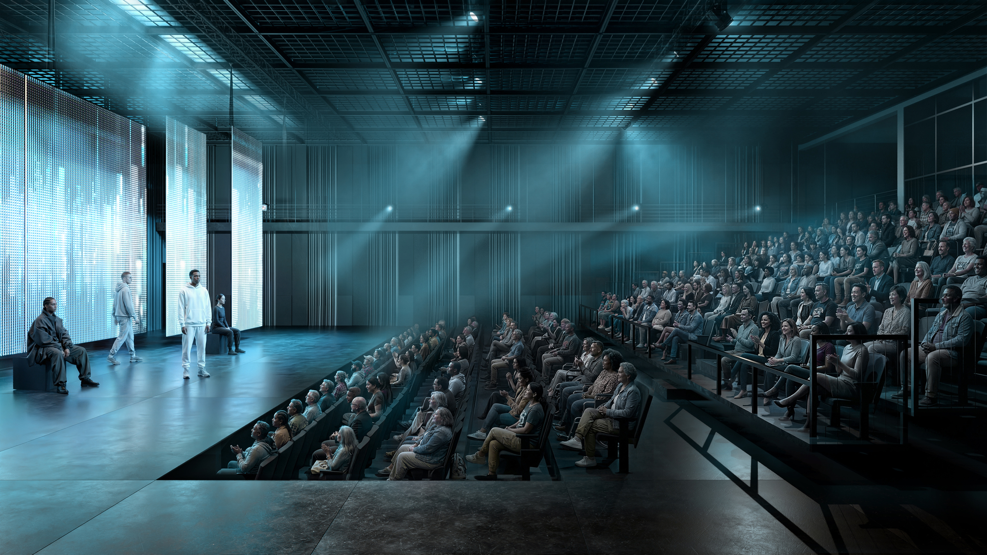 Theater auditorium with raked seating, glass-paneled stage, and dramatic ceiling spotlights cutting through haze