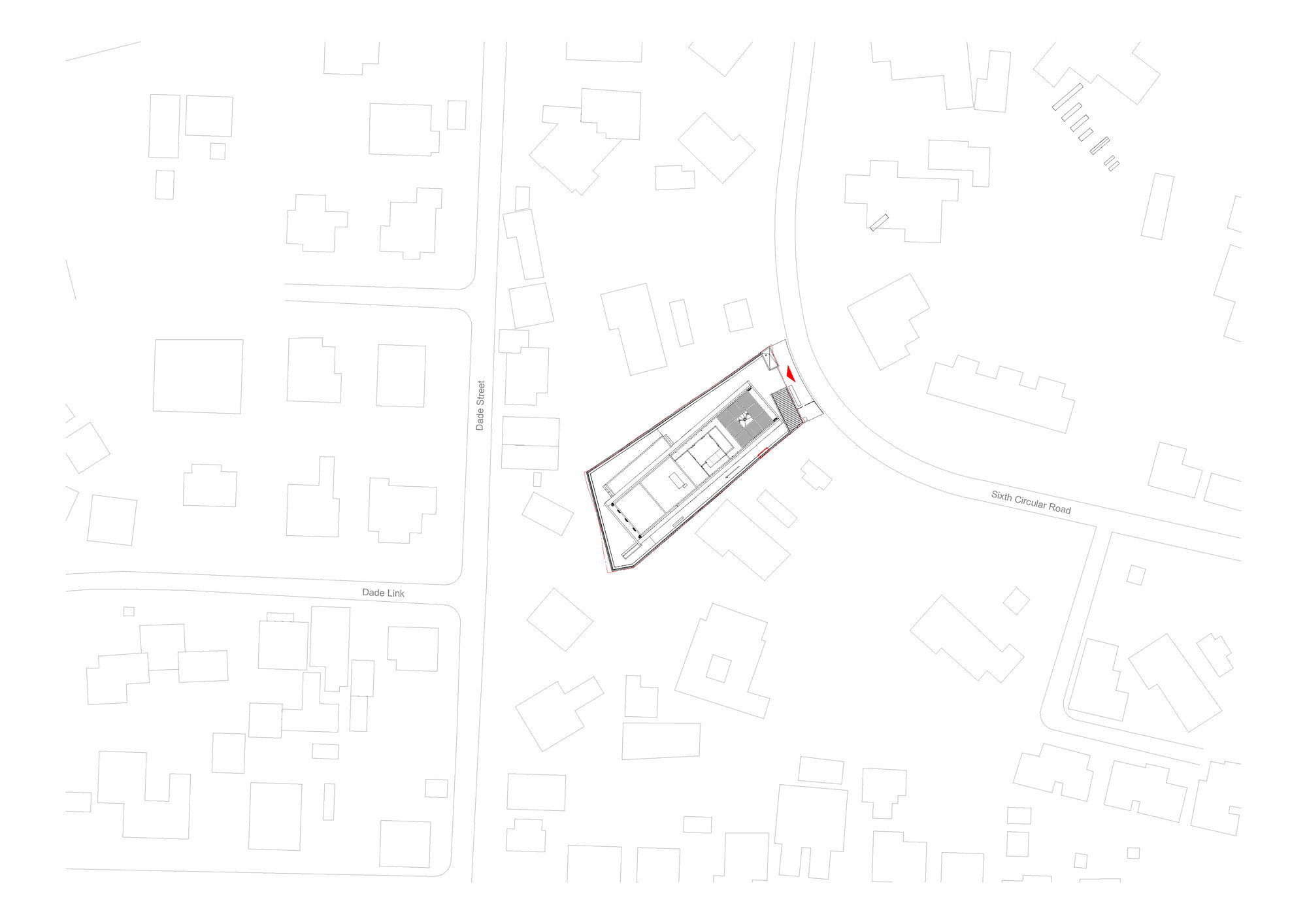 Site plan drawing showing a trapezoidal building footprint within surrounding urban blocks