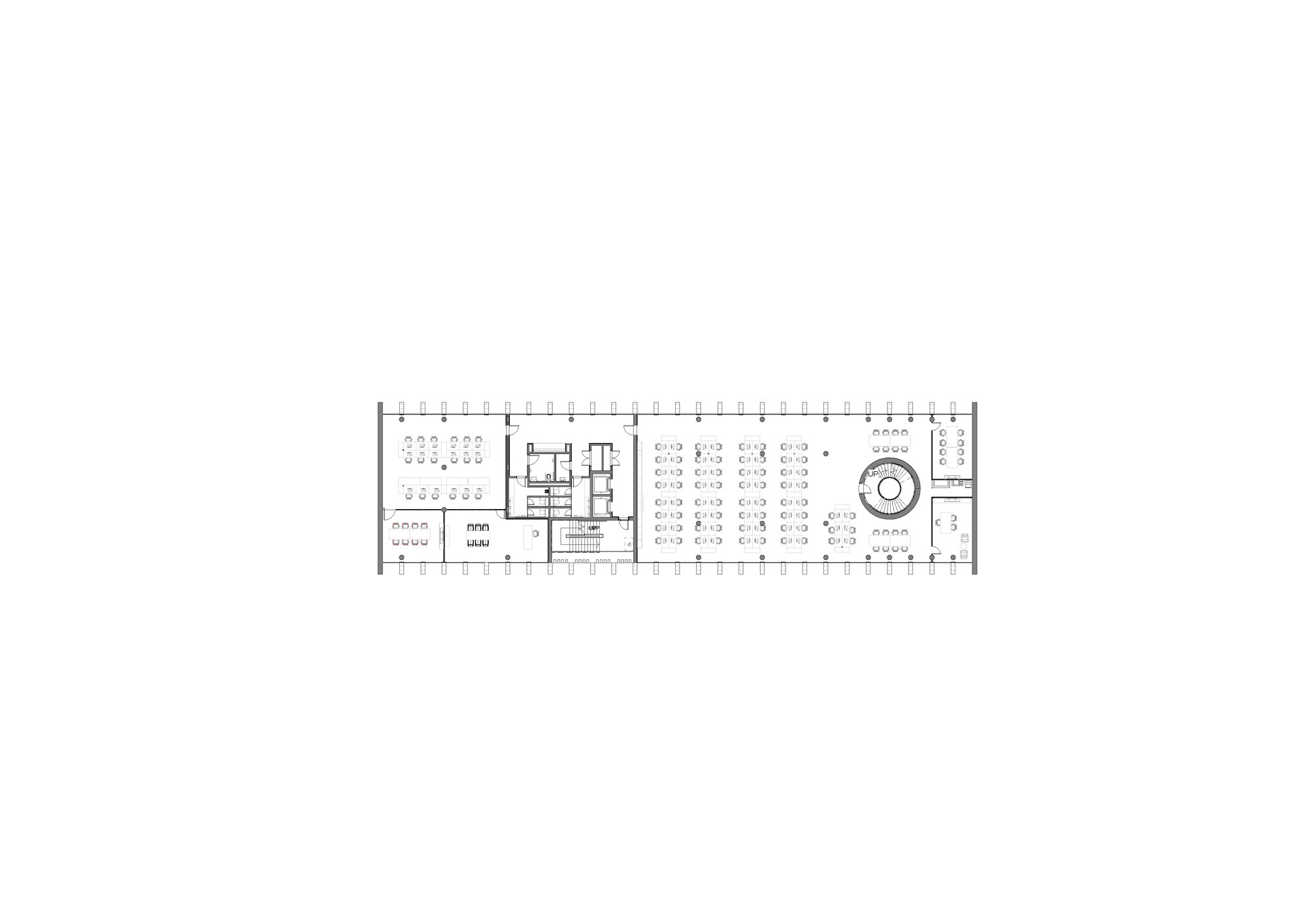 Floor plan drawing showing a long rectangular volume with workstations and a circular feature at one end