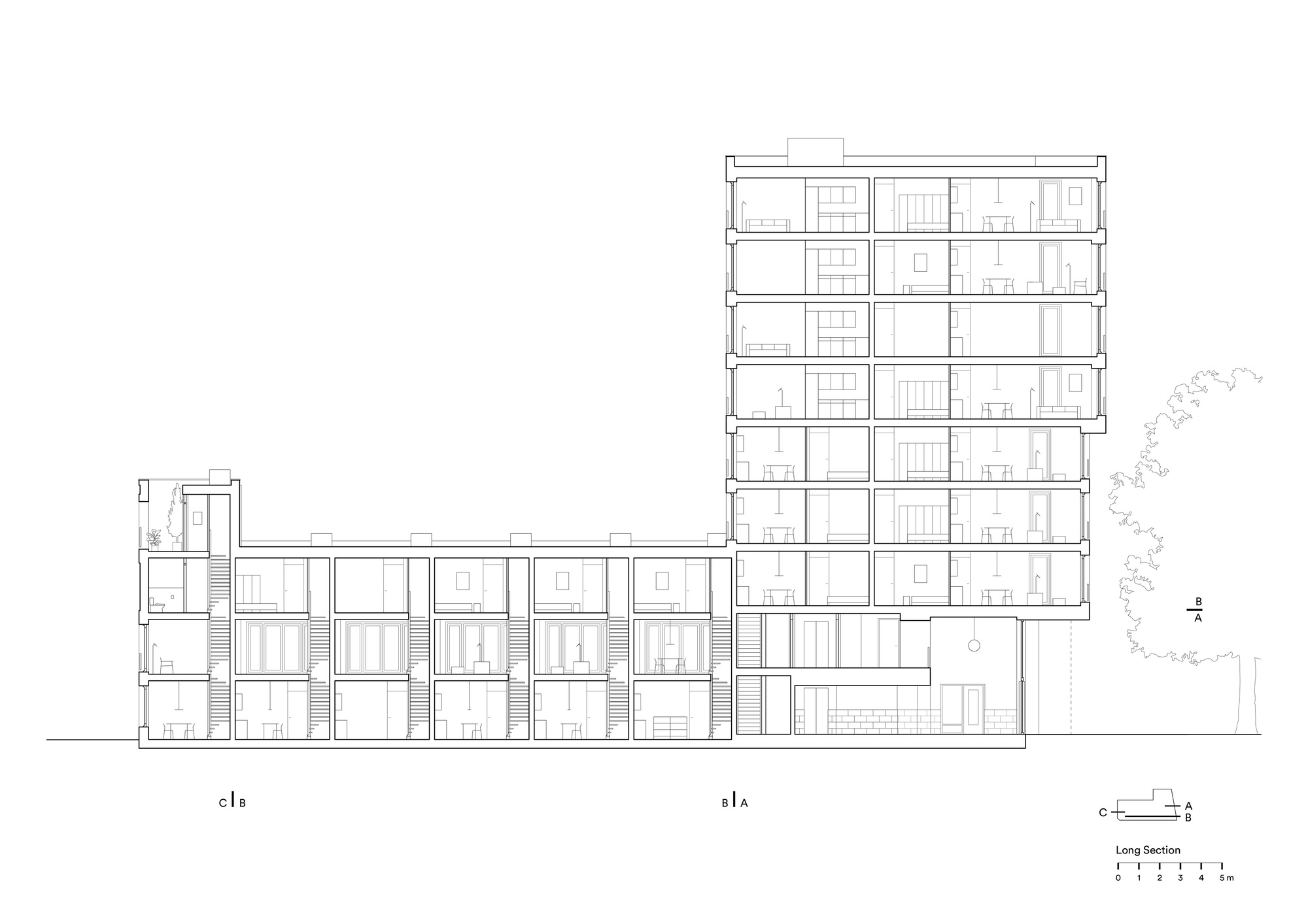 Long section drawing showing a multi-story residential block with stair cores and unit divisions