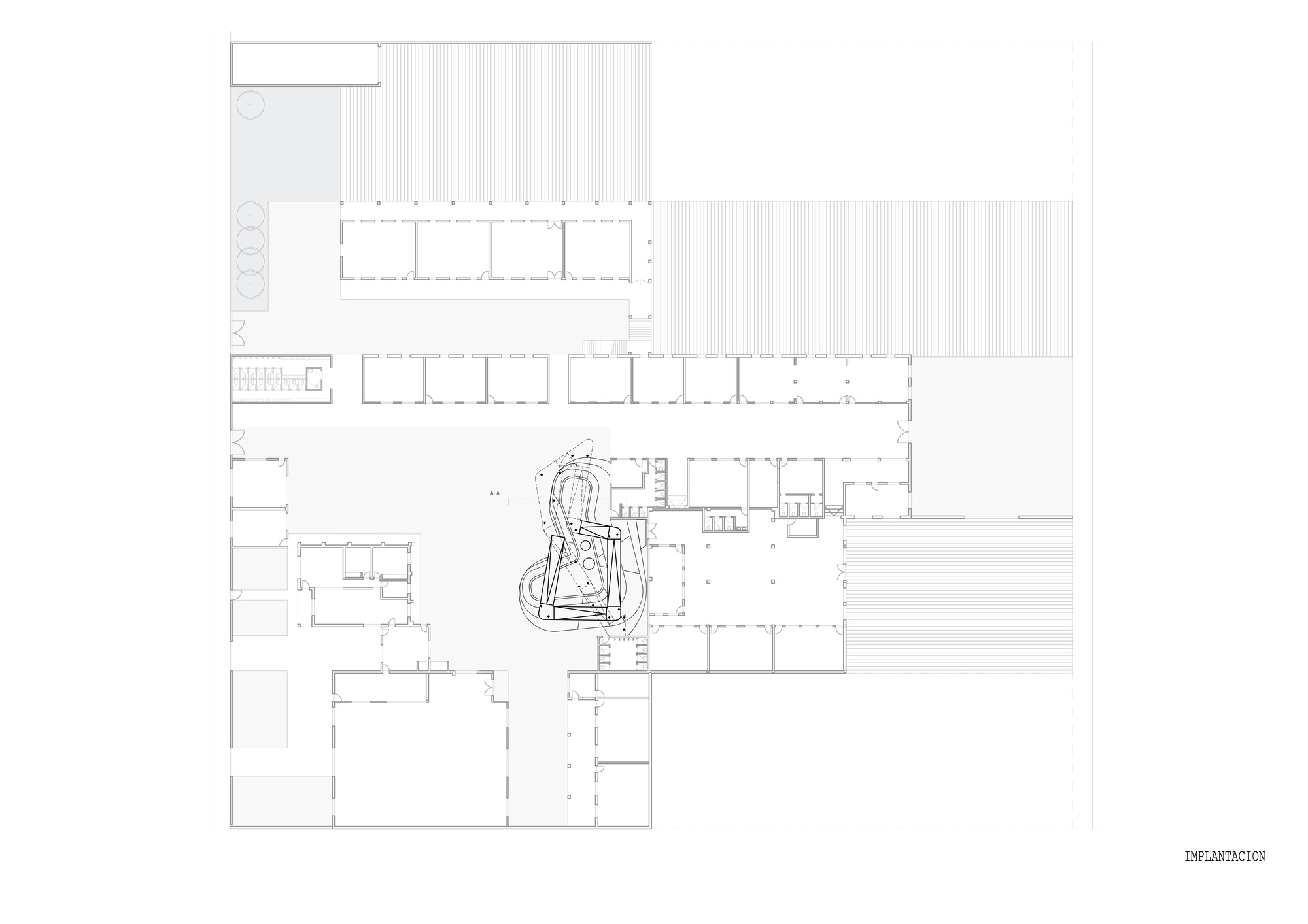 Floor plan drawing showing classroom wings arranged around a central courtyard with play elements
