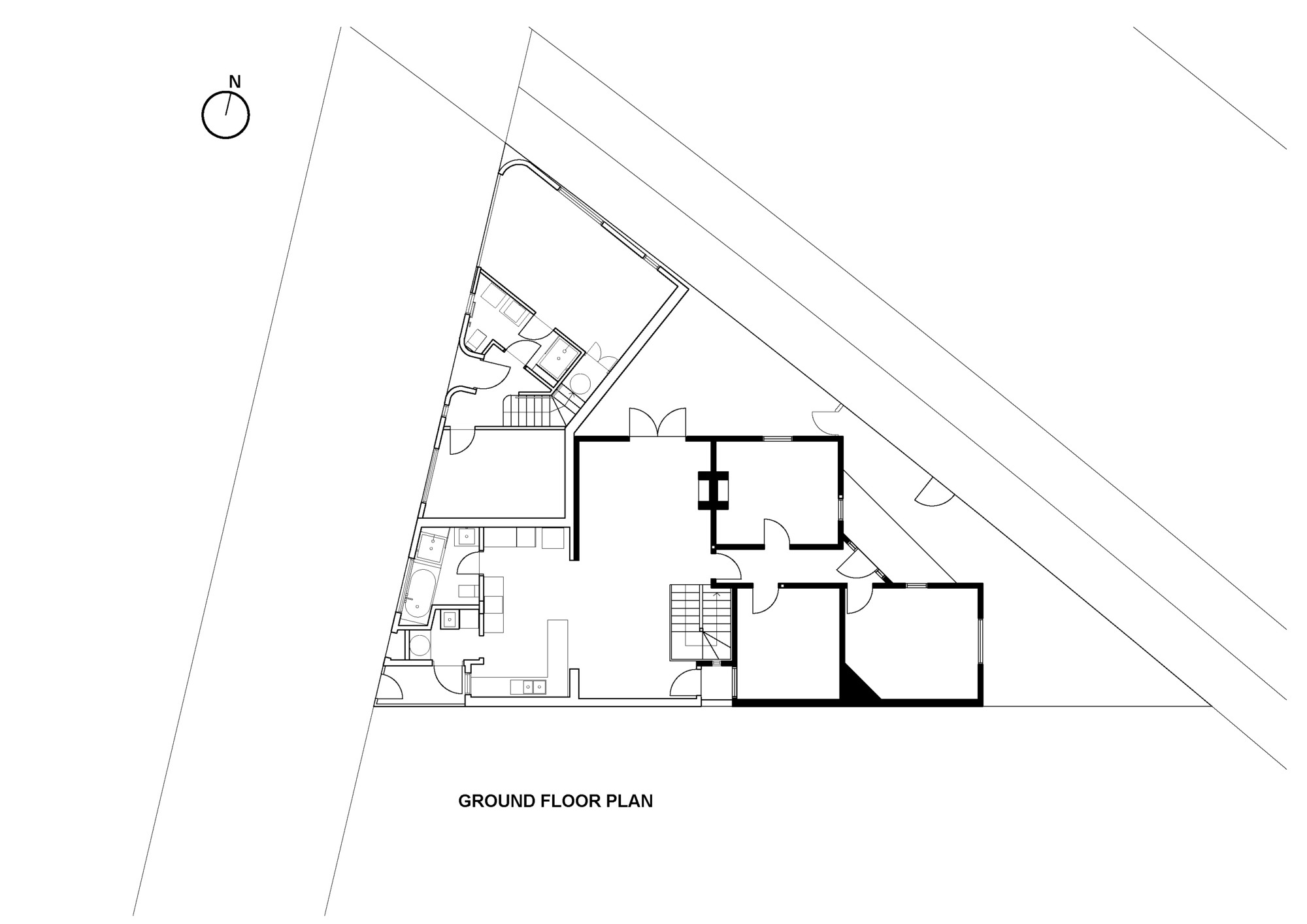 Ground floor plan drawing showing angular site boundaries with rooms arranged around a central stair core