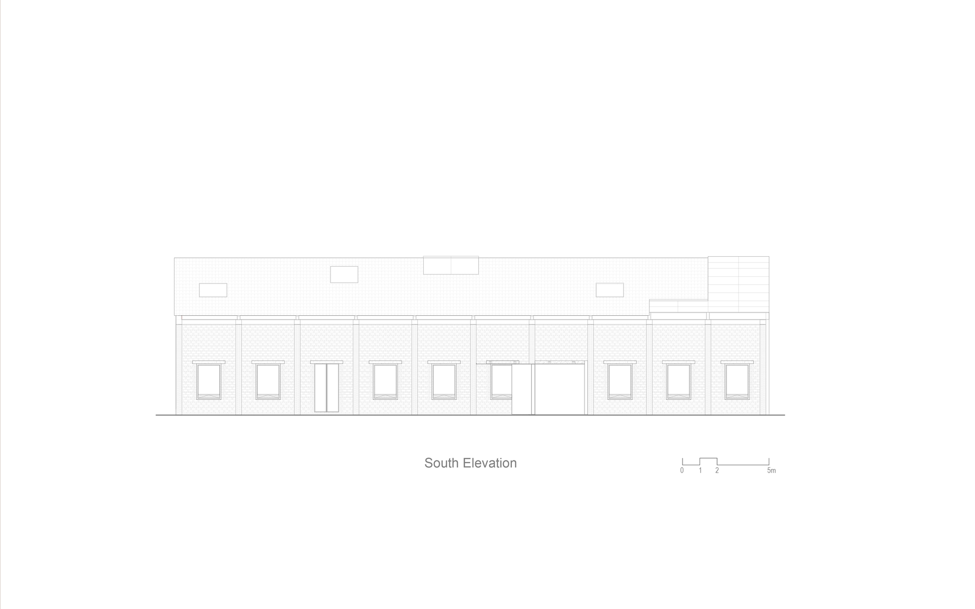 South elevation drawing showing a long single-story facade with patterned brickwork and regular window openings