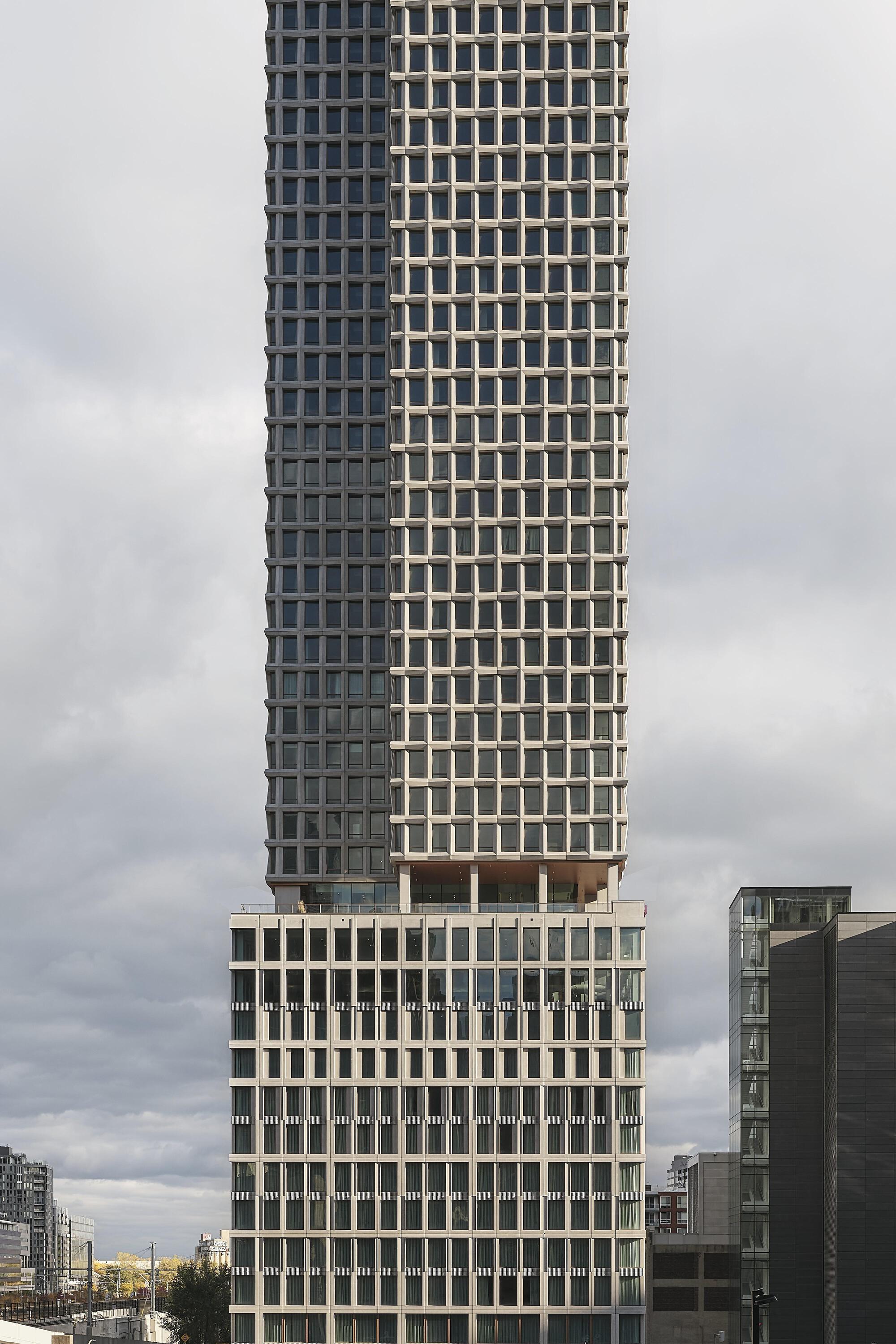 Mid-section of the precast concrete facade showing the offset between upper and lower tower volumes