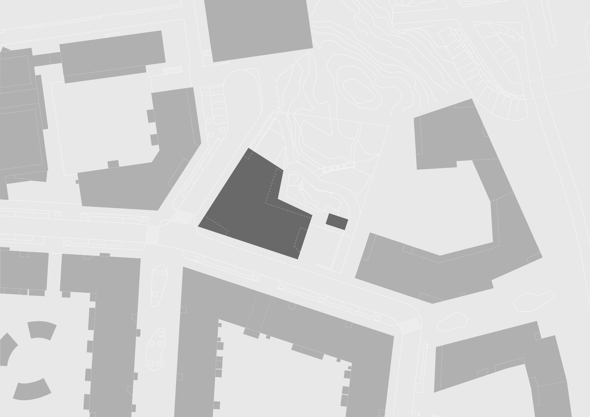 Site plan drawing showing an angled building footprint positioned among surrounding urban blocks