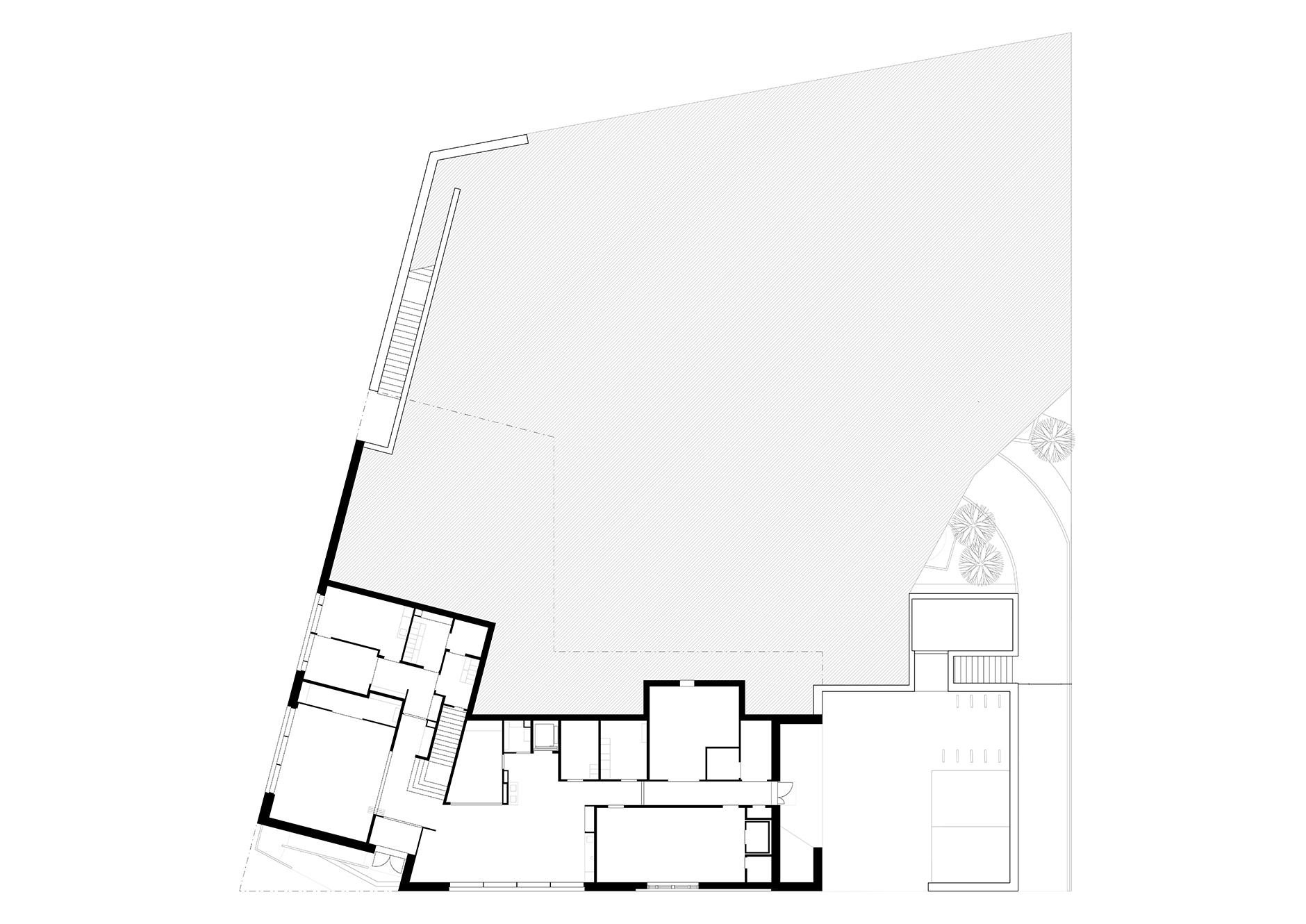 Ground floor plan drawing showing angled interior rooms and a large open courtyard area