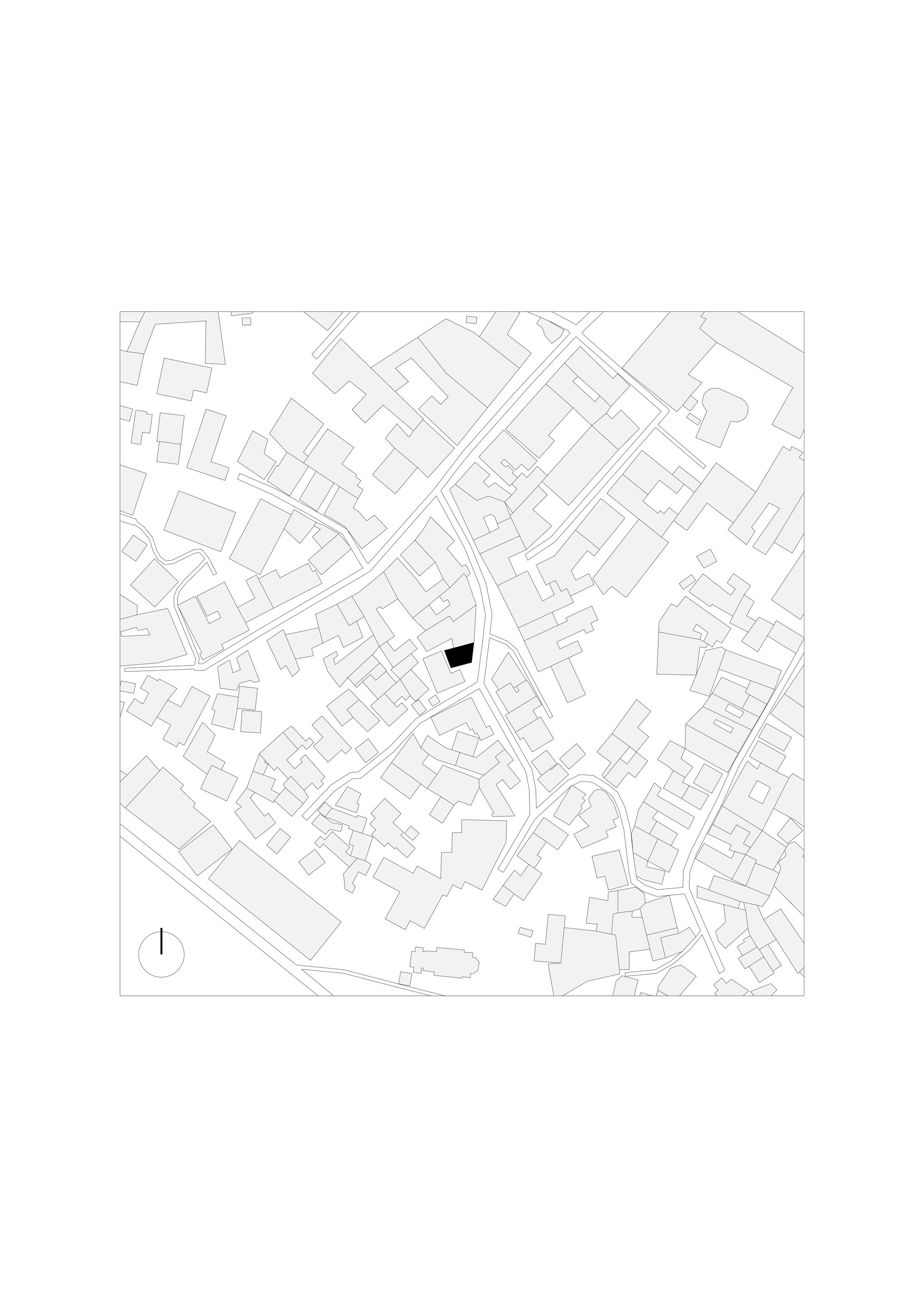 Site plan drawing showing the building footprint highlighted in black within the surrounding urban fabric