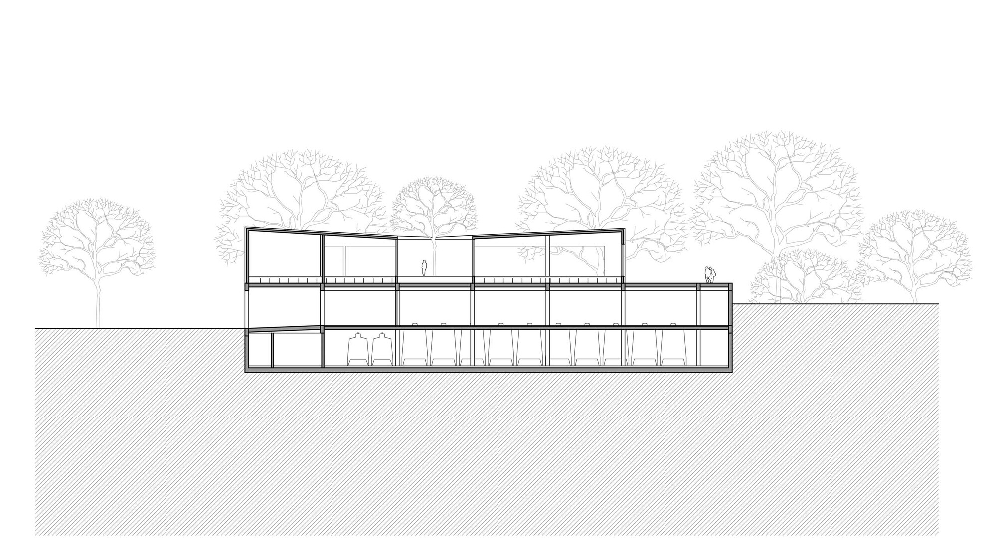 Section drawing showing a three-story linear building with columns and arched openings on sloped terrain with trees