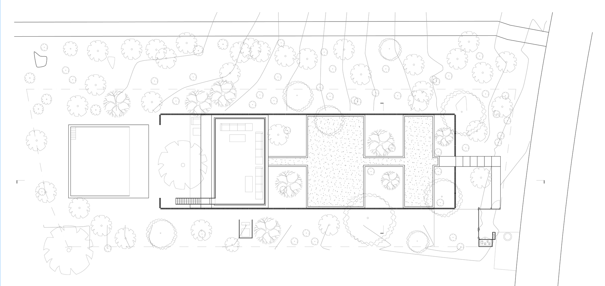Site plan drawing showing linear volumes surrounded by landscaped grounds with scattered tree symbols