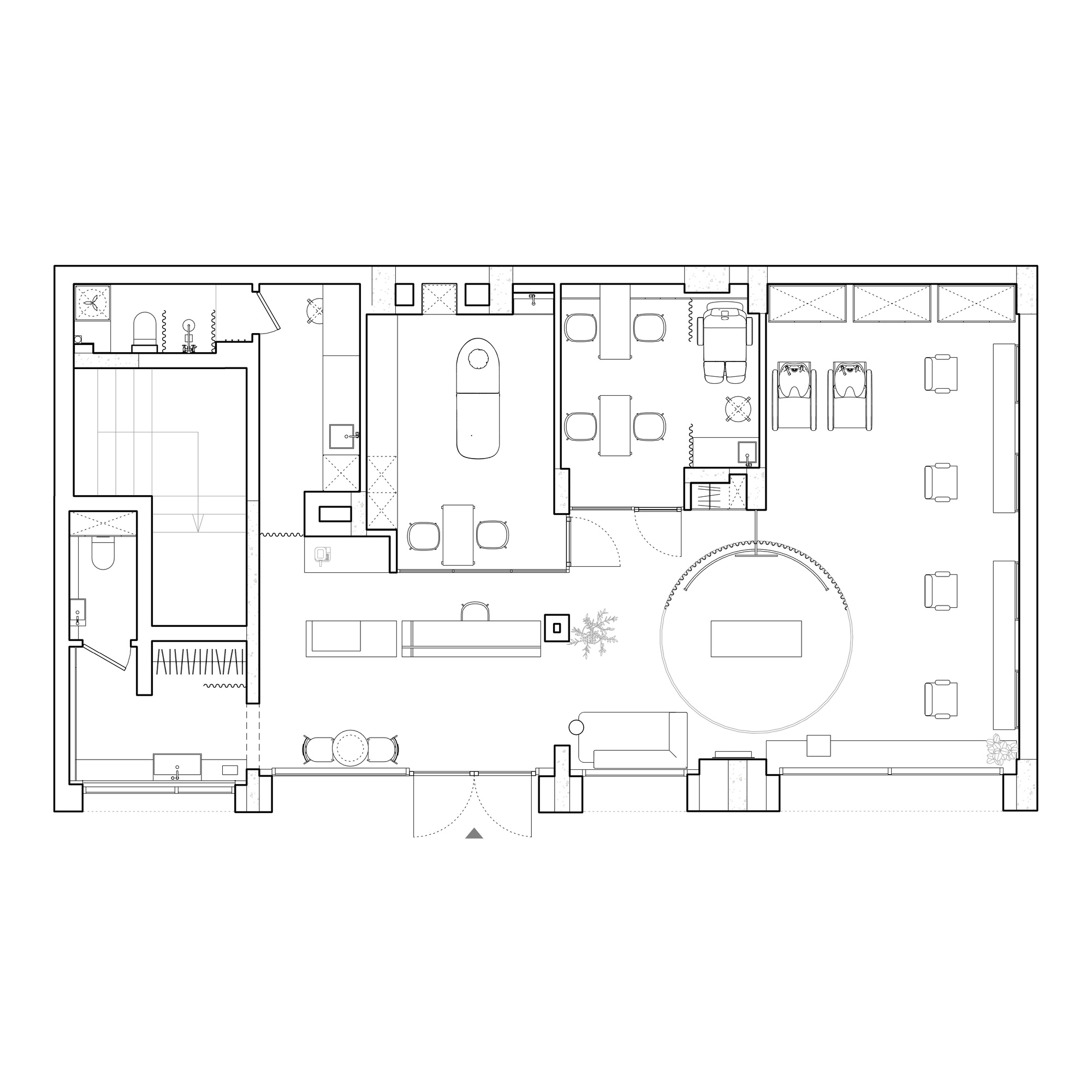 Floor plan drawing showing furnished interior spaces with a circular feature and divided program zones