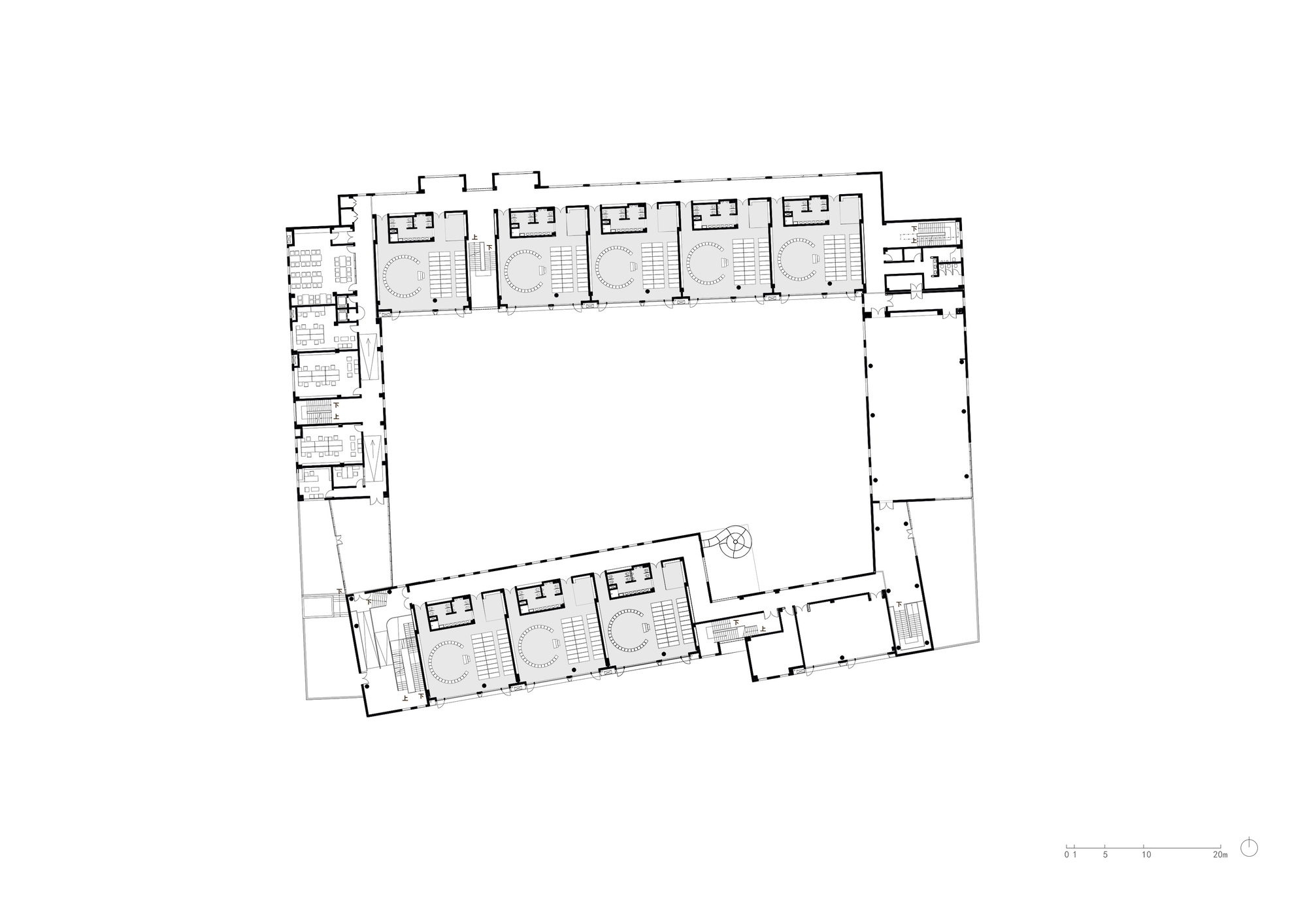 Ground floor plan drawing depicting repeating classroom units along two wings framing an open courtyard space