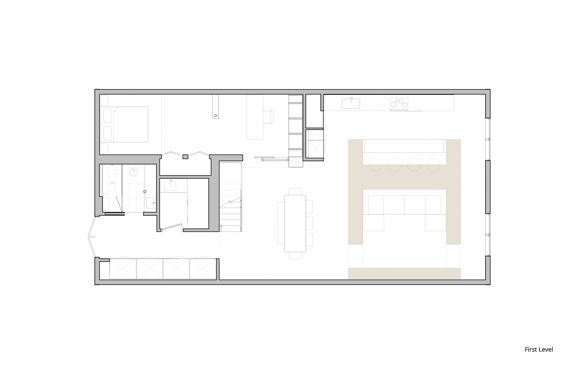 First level floor plan drawing showing open living area with kitchen and bathroom zones