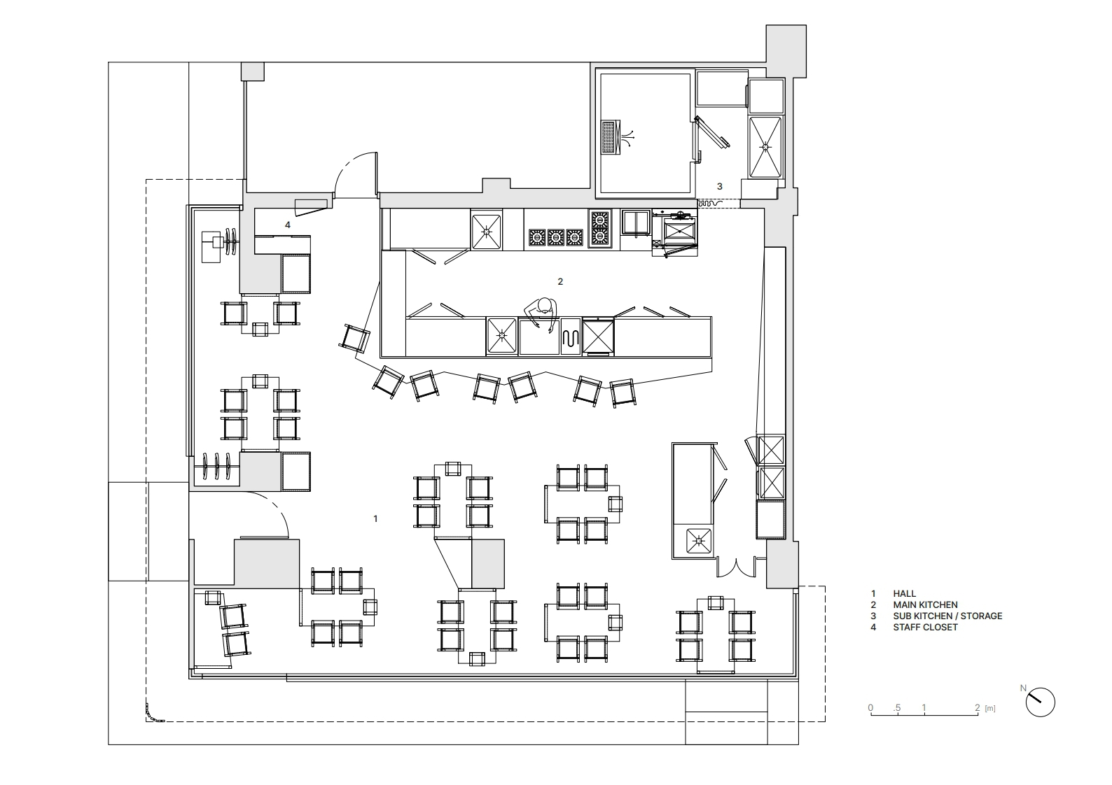 Floor plan showing an open dining area with scattered table groupings and a galley kitchen along one wall