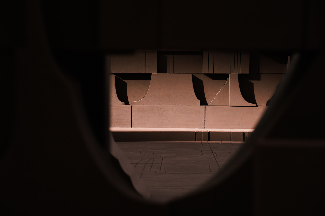 View through a circular opening into a cardboard model with scalloped canopy elements above