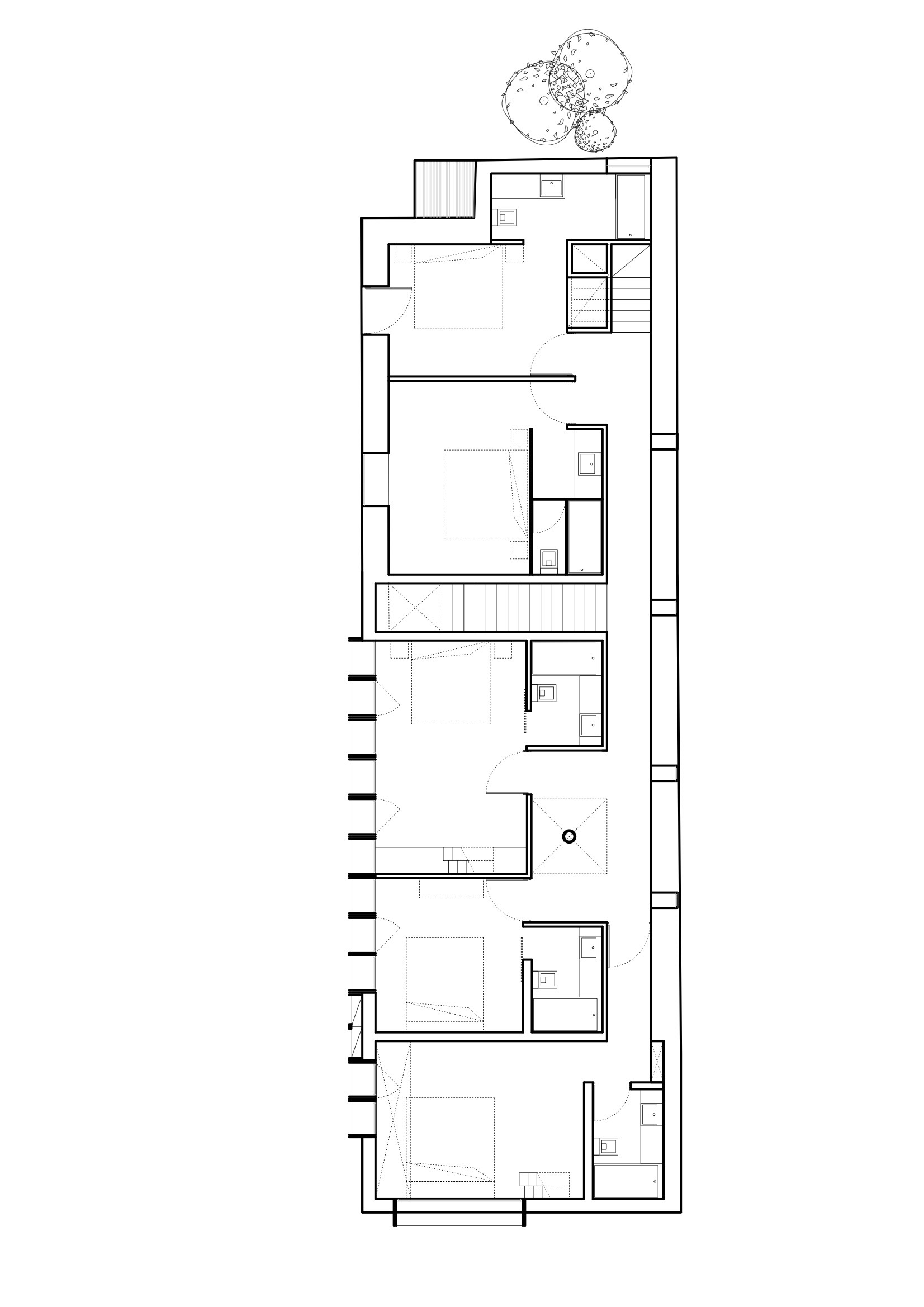 First floor plan drawing showing bedroom layout with bathrooms and central staircase