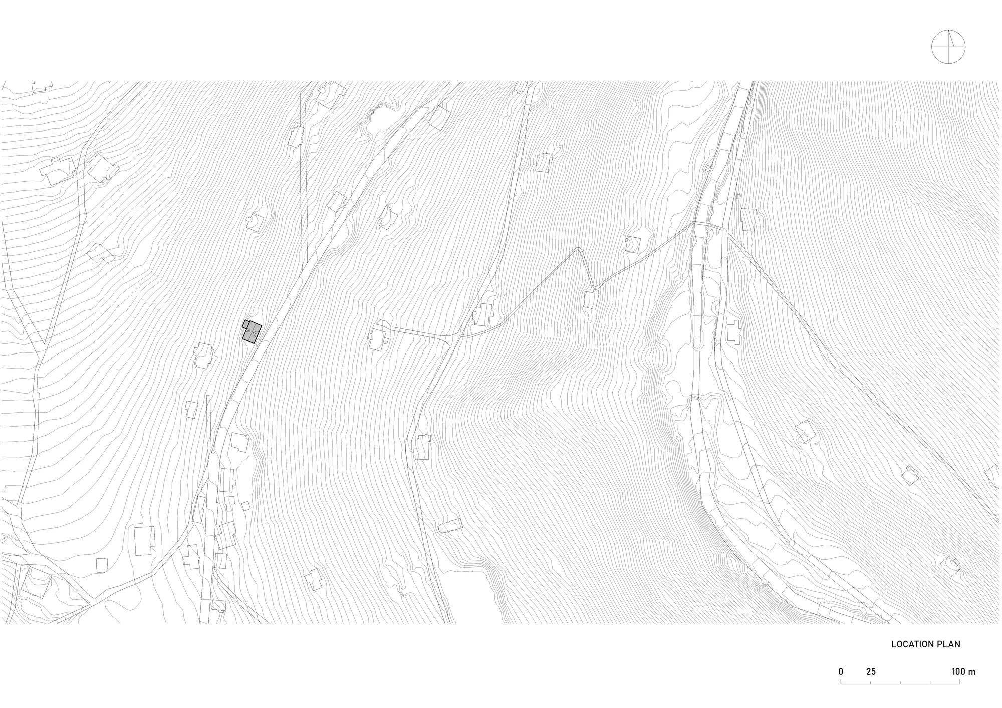 Site plan drawing with topographic contours showing the building placement on sloping terrain