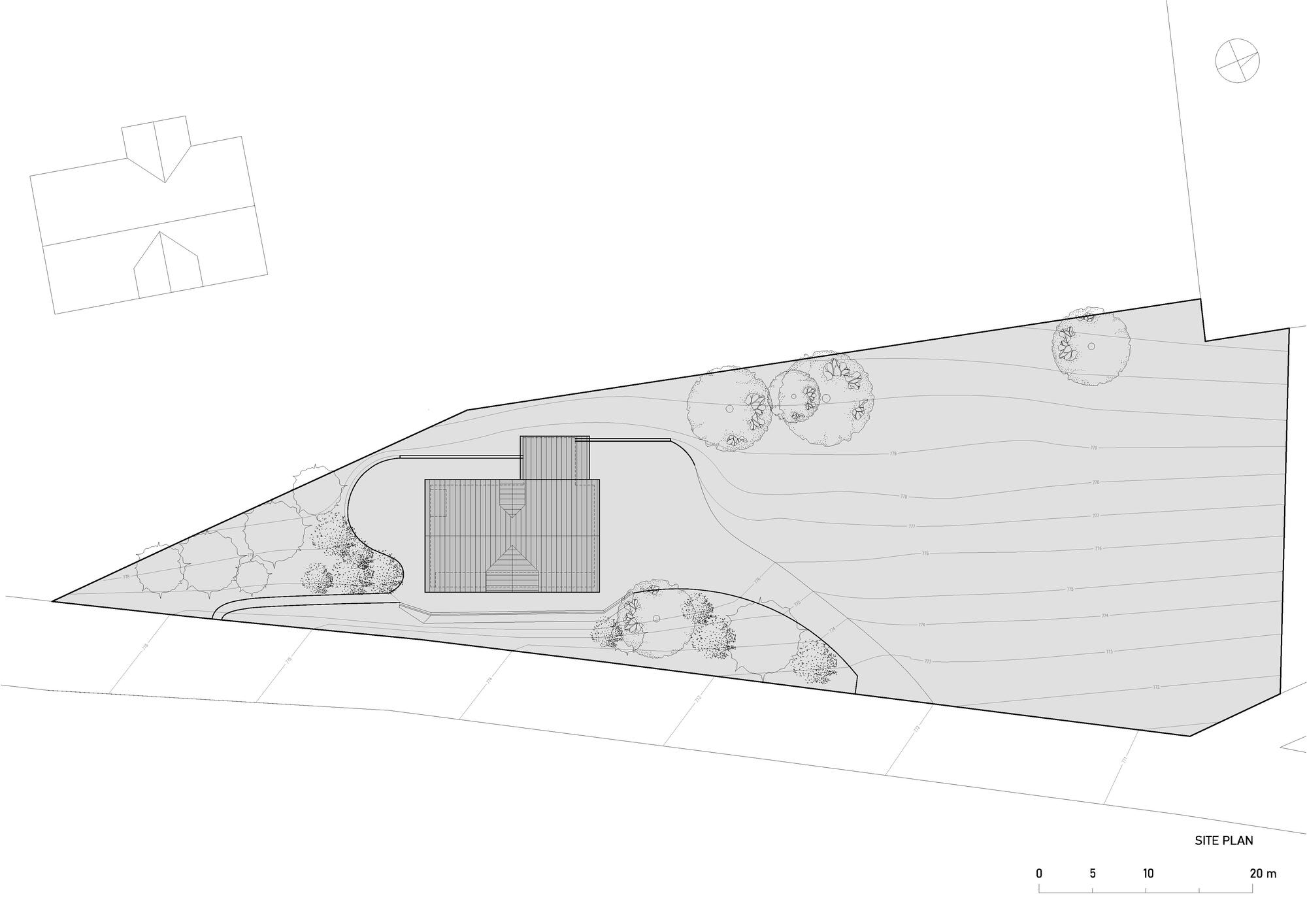 Site plan drawing showing a rectangular volume on a triangular plot with planted areas and adjacent structure