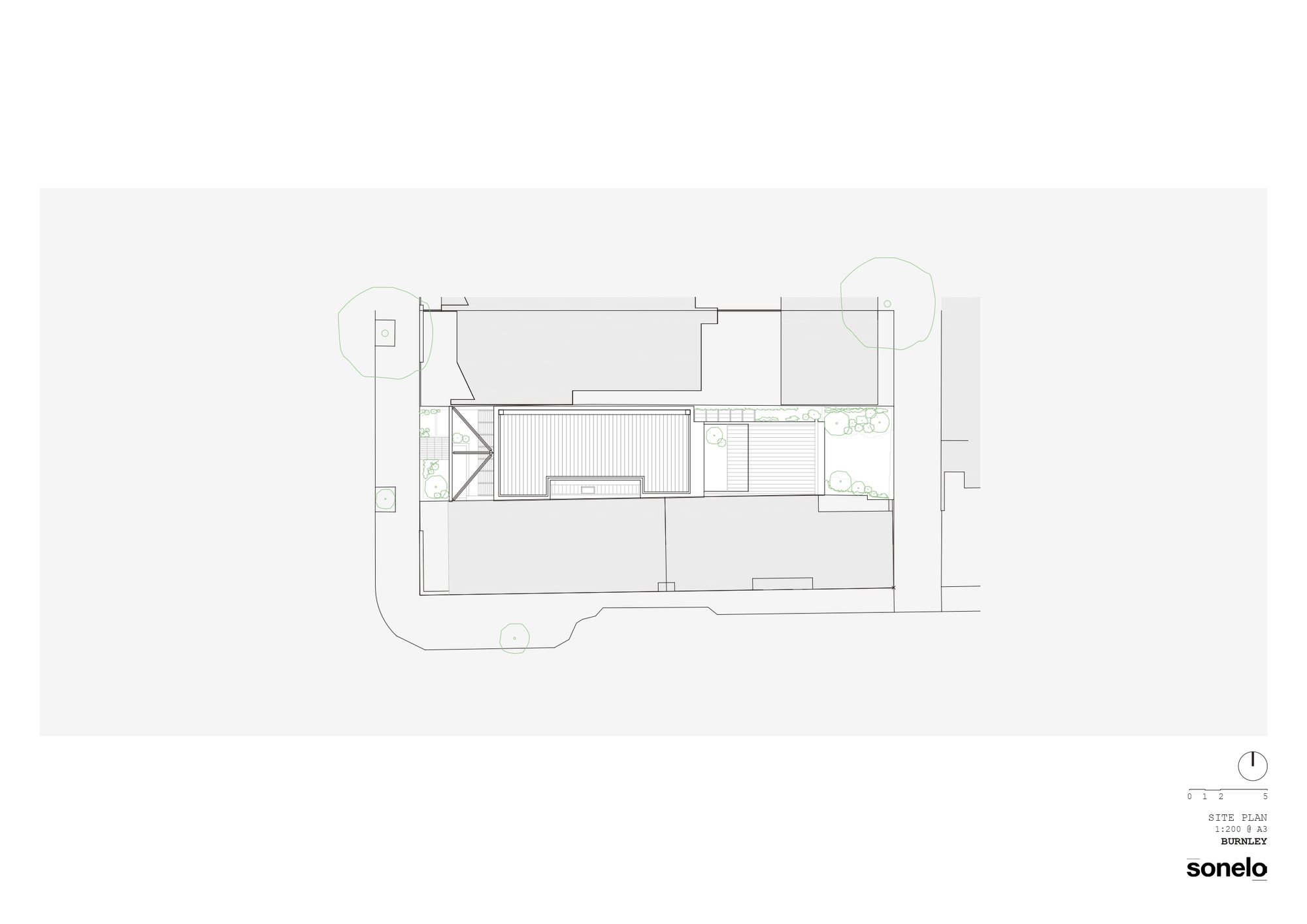 Site plan drawing showing building footprint with courtyard and surrounding landscape elements