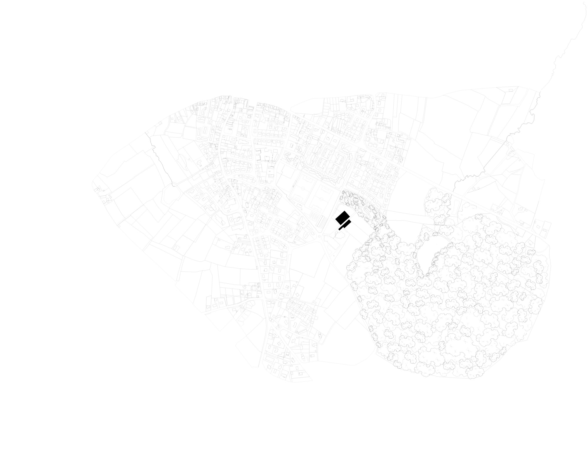 Site plan drawing showing a single building footprint within a detailed urban context