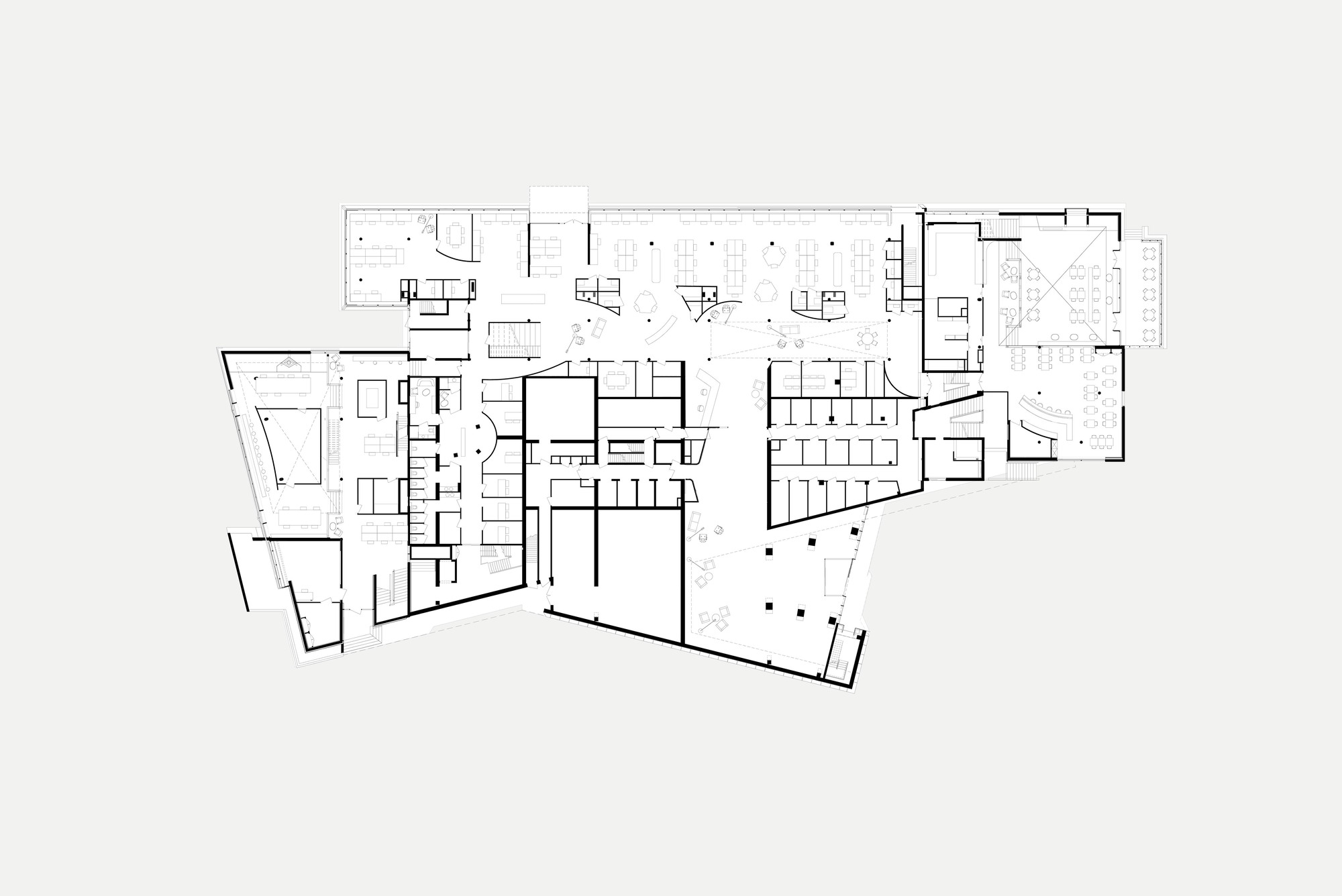 Floor plan drawing revealing a large central hall flanked by smaller rooms and angled wings