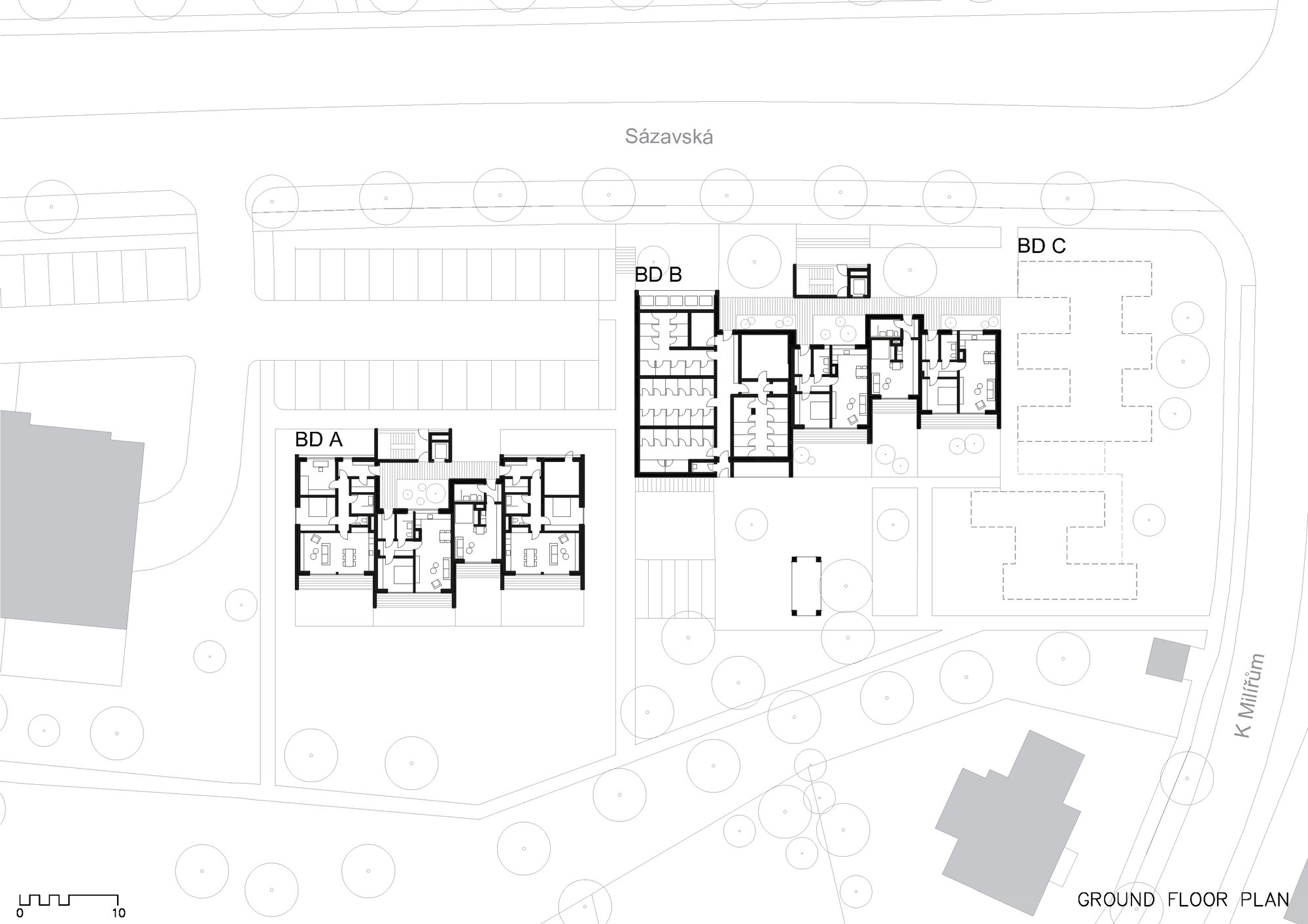 Ground floor plan showing three residential blocks with surrounding landscaped areas and circular trees