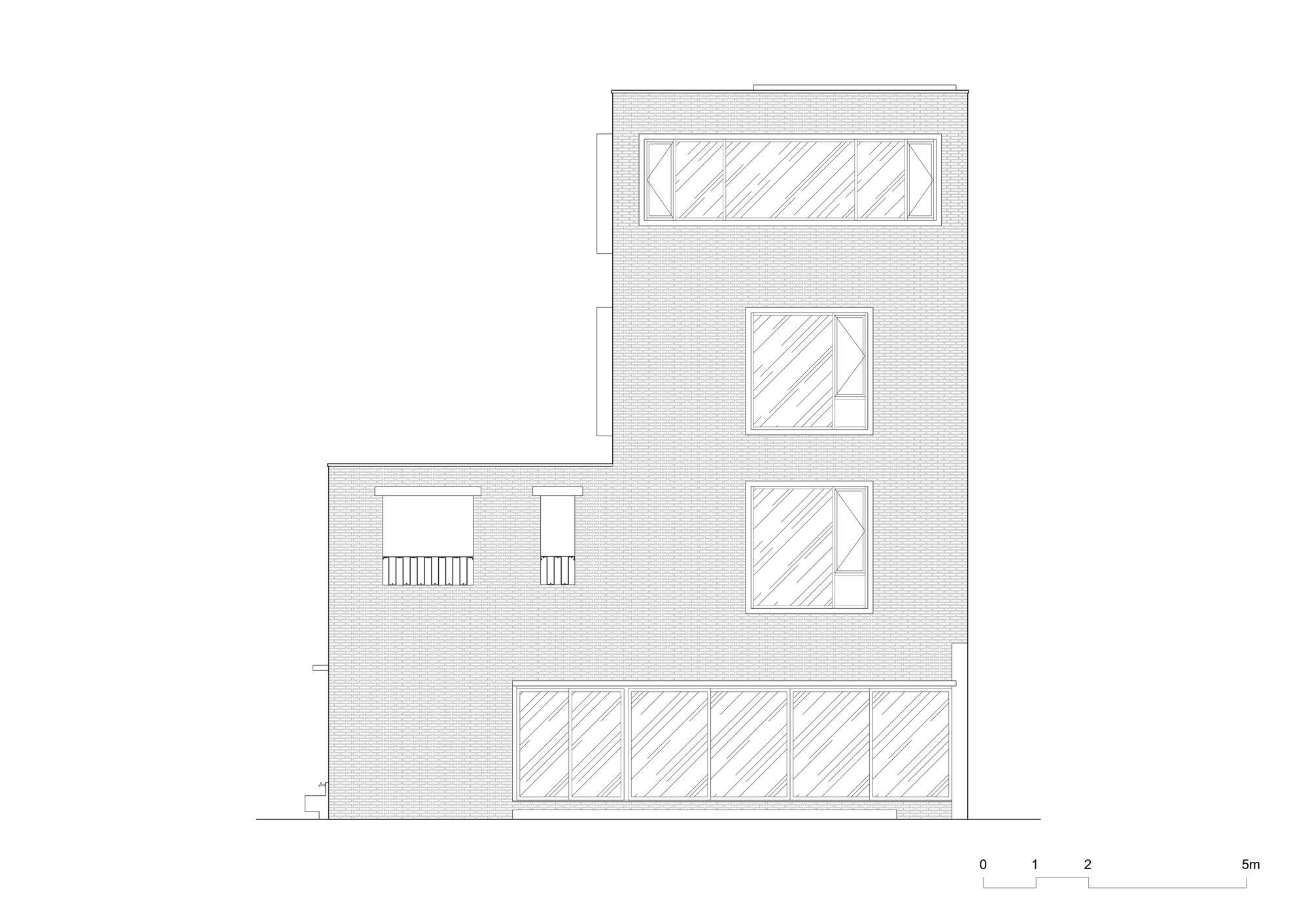 Elevation drawing of brick facade with varied window openings across three stories