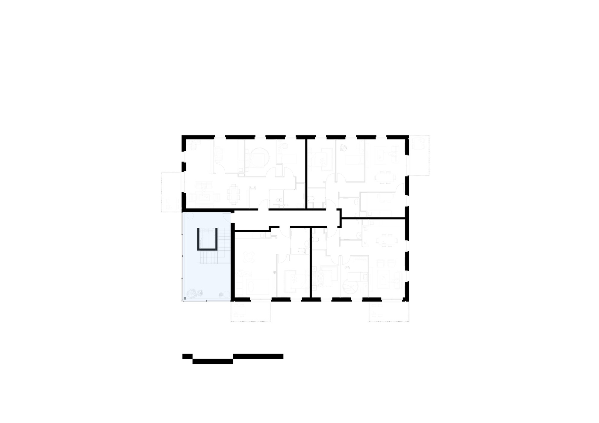 Floor plan drawing showing rectangular layout with rooms surrounding central circulation space