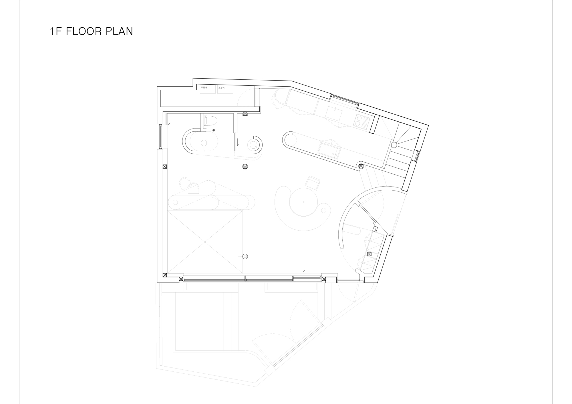Floor plan drawing showing first level with bathroom fixtures and angled perimeter walls