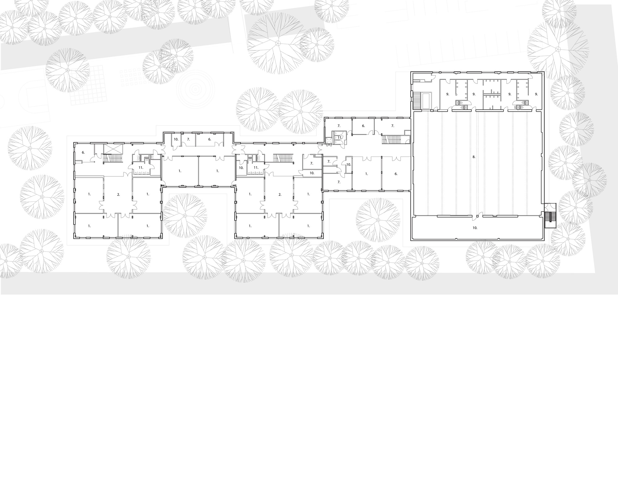 Floor plan drawing showing interconnected classroom wings with gymnasium and courtyard spaces