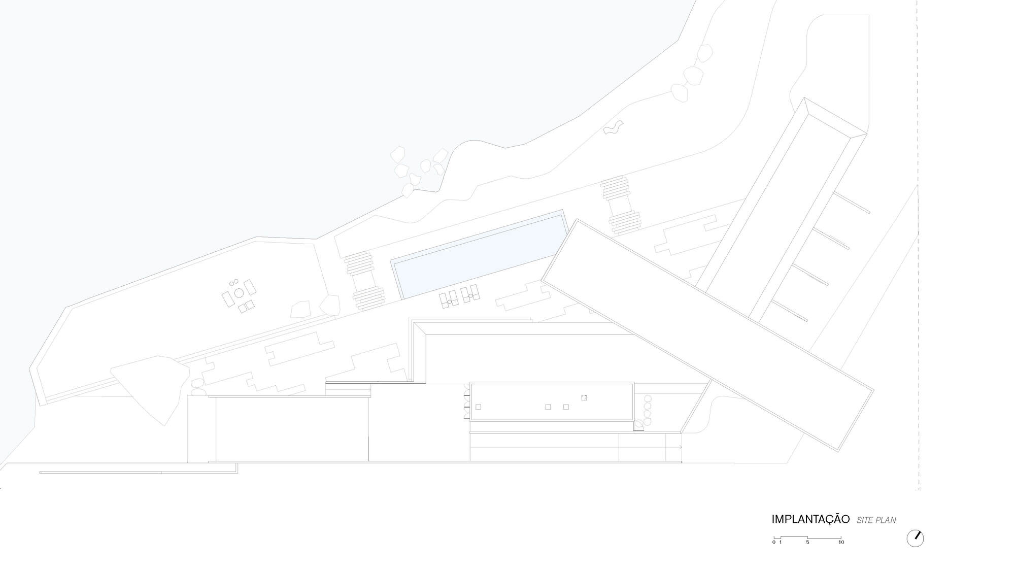 Site plan drawing showing angular building volumes positioned along sloping topography