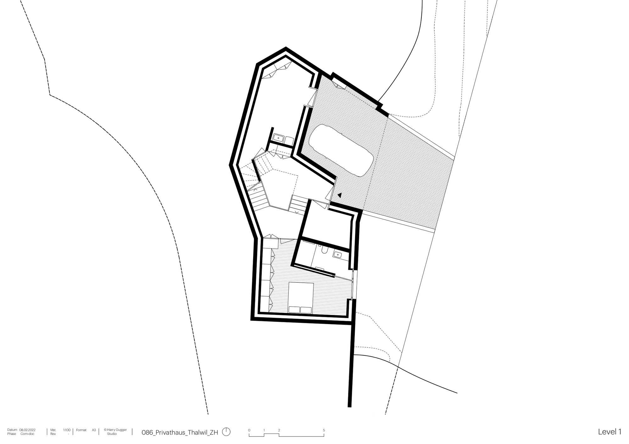 Floor plan showing angled building with entrance, staircase, and covered terrace on sloped site