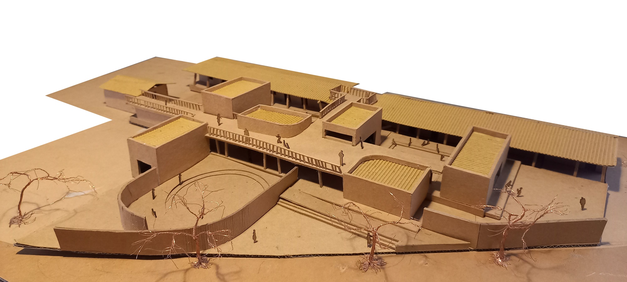 Physical model in cardboard showing clustered volumes around a curved amphitheater with wire trees