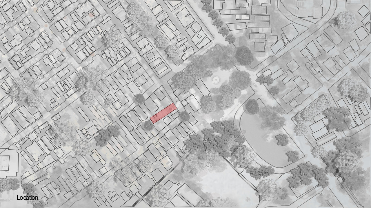 Site plan drawing showing a narrow residential plot highlighted in red within a dense urban neighborhood